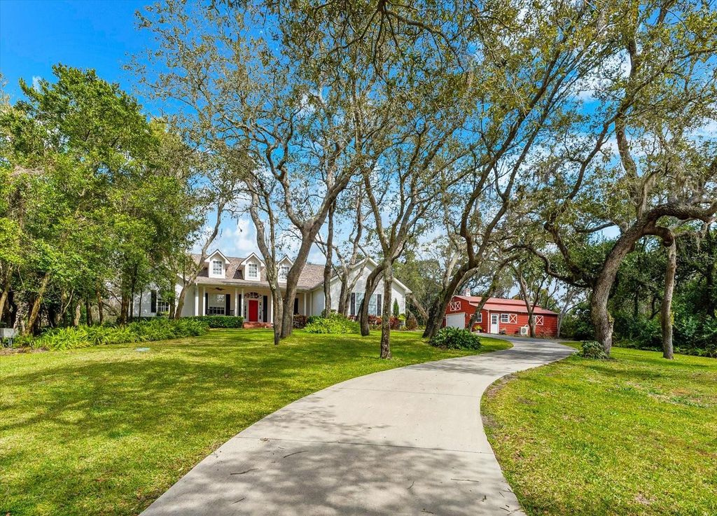 Photo of 653 Old East Lake Road, Tarpon Springs, FL 34688 (MLS # TB8469264)