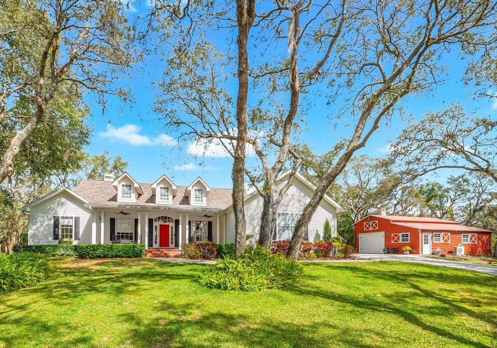 Photo of 653 Old East Lake Road, Tarpon Springs, FL 34688 (MLS # TB8469264)