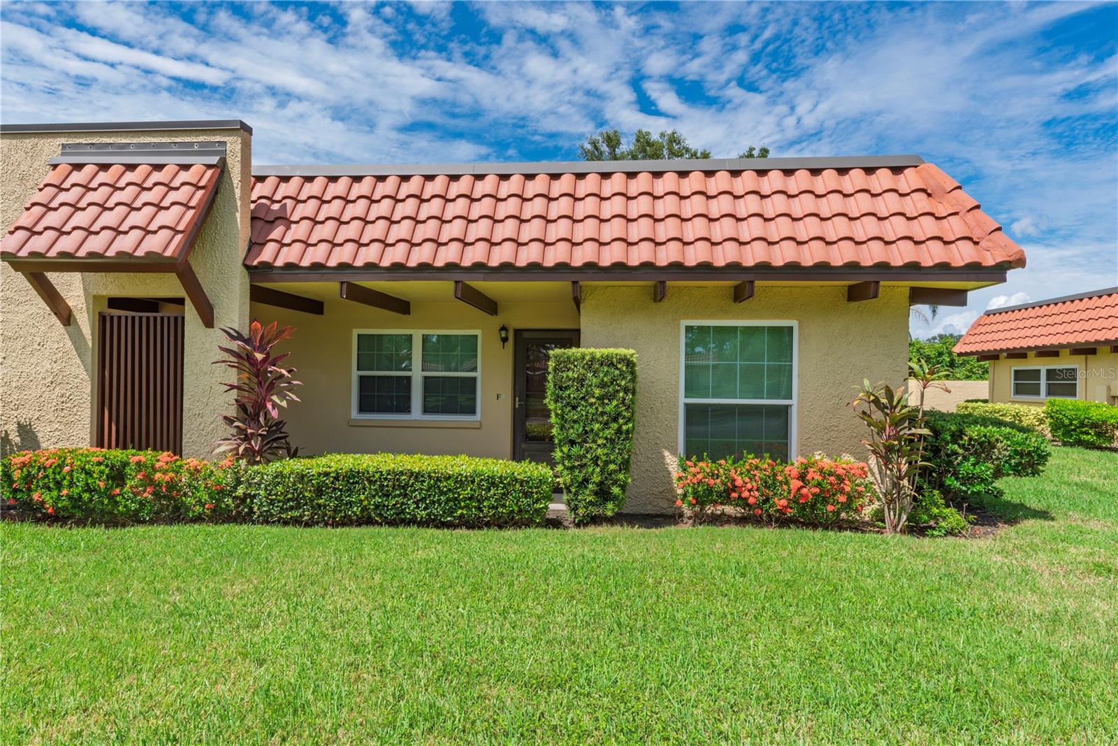 Ready to swap high-maintenance for high-enjoyment? This furnished, end-unit villa-style condo in Dunedin’s vibrant 55+ Pinehurst Village offers laid-back living, updated comfort, and a little extra elbow room — no one above, no one to the left, and no rear condo neighbors (just a privacy wall and residential homes behind it).
Inside, the smart layout includes a split plan with 2 bedrooms, 2 full baths, and a flexible bonus room at the back for hobbies, an office, reading, or extra guests. The vibe is clean, light, and move-in ready with luxury vinyl plank flooring (2023), new baseboards (2023), interior paint (2023), and kitchen cabinets freshly painted in 2025. You'll also enjoy the updated electric panel (2023), double-pane & insulated impact windows (2023), HVAC (2017), and water heater (2010). Laundry is easy with a stackable washer & dryer inside the unit. And big-ticket win: the roof was replaced in 2023 by the condo association.
Out back, the open-air patio is perfect for a morning coffee or evening glass of wine — and with no one behind you, it actually feels private. You have an assigned covered parking space and guest parking for visitors is available as well.
This is an active community with a clubhouse and pool, shuffleboard courts, and picnic area with grill. The Dunedin Community Center and Fine Art Center are just around the corner offering fitness classes, art workshops, and events all year long. You’re also just minutes from Downtown Dunedin, The Pinellas Trail, Honeymoon Island, golf courses, parks, public transportation, and everything else that makes this town one of Florida’s hidden gems.
Whether you're here for the winter season or settling in full-time, this villa makes life easier — and better.