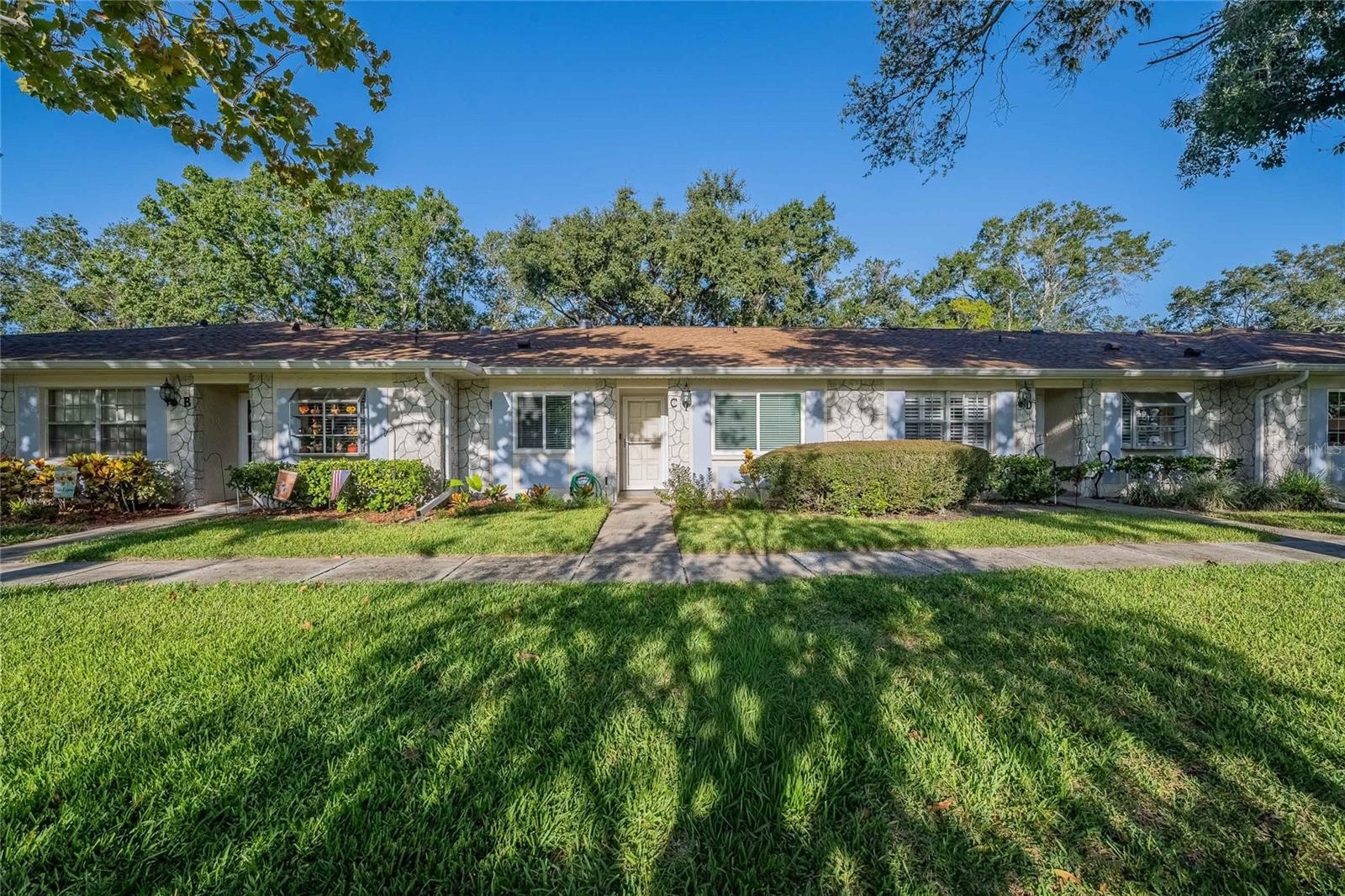 This Lovely 2 Bedroom, 2 Bath Condo is located in a prime location in the highly sought after 55+ Highland Lakes Community. This beautifully maintained Condo offers an open floor plan creating a very spacious feel. The master suite is very spacious and allows for king size bed and more. Master bathroom offers a double sink vanity, a large walk-in closet, as well as a 2nd closet, and a nice sized shower. The second bedroom is a great size for a guest room or an office. Bonus room can be used as a nice relaxing sitting room, den, or office. The main space offers beautiful wood look porcelain tile throughout. The skylights allow nice natural lighting throughout the main space. The kitchen offers plenty of storage and cooking space, great for entertaining. Unit has been well maintained with the following recent upgrades, roof replaced in 2022, and hurricane impact windows 2021. This unit also features an In-unit laundry room with washer & dryer, detached storage shed, and covered parking. Condo is close to all the attractions to include the beautiful Pinellas County beaches and all the Tampa Bay attractions. This condo sustained no damages from Hurricane Helene or Milton. This condo has access to great community amenities to include free golf on the 27-hole executive golf course, tennis, pickleball, bocce, shuffleboard, Olympic size geothermal pool and spa, 2nd lakefront pool, RV/Boat storage, boat ramp, dock, Community center, lending library, organized community events to include cards and games, billiards, arts and crafts, and woodworking. Community also offers exploration of Lake Tarpon, with a lunch stop at a local lakeside restaurant onboard one of its pontoon boats. The clubhouse also features a lively calendar of events to include dinners, dancing, bingo, and live shows. Residents also have access to the Lodge on Lake Tarpon, offering picnic tables & grills, pool, and waterfront dock with great lake views. This home offers much more than just a home; it's an active lifestyle and community.