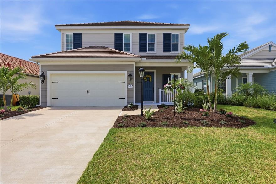 Wait till you see this rarely available "Heritage" floorplan with its modern features, impeccable condition AND premium rear water view! This expansive home boasts 4 bedrooms, a LARGE loft area, 3 bathrooms, 2-car garage and an extended covered lanai overlooking the full length of one of Indigo's largest lakes! Rest assured your new home is built strong and safe with its HURRICANE IMPACT RATED WINDOWS throughout, cinder block construction, concrete tile roof and is located in the highly desirable X floodzone. Throughout the interior you will find 5 1/4" deco baseboards, luxury vinyl plank flooring, multiple tray ceilings, LED recessed lighting, high end light fixtures, high level quartz countertops throughout and much more! The great room with its expansive tray ceiling showcases a spacious environment with a front row view of the rear lake and more than enough room to entertain guests. For all the kitchen enthusiasts, you will surely gravitate to this custom kitchen featuring a large island with a breakfast bar, custom Mosaic marble tile backsplash, premium soft-close shaker cabinetry with LED undermount lighting that complements the high-level quartz countertops AND and an oversized walk-in pantry. Open the three-paneled HURRICANE IMPACT RATED sliders and prepare to be absolutely amazed! Your new lanai provides a full-length view of one of Indigo's largest lakes, which is home to many turtles and a flock of ducks! Your new lanai also has a builder grade gas stub suitable for any gas grill or a future kitchenette! The desirable exterior of this home, combined with a larger-than-normal lot size offers ample room for a future pool or a full lanai extension! Indigo is an active community that features a full-time on-site manager as well as a full-time activities director who manages an extensive calendar of activities for all ages. A-Rated Gullett Elementary AND Mona Jain Middle school are right outside our gates too! You can also expect sidewalks on both sides of the street, a resort-style heated community pool/spa at the main clubhouse where you will find 5 cabanas with an abundance of seating, 4 pickleball courts, 2 bocce ball courts, a 24-hour exercise gym, a meeting room/banquet room, and a playground. Indigo is not only a community that takes care of all ground maintenance—including mowing, fertilizing, irrigation, shrubs and mulch but is right around the corner to a plethora of dining, banking, entertainment, public transportation and MORE!