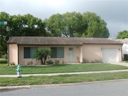 Nice corner lot house with 2 bedrooms, 2 bathrooms, updated kitchen, all ceramic tile, screened patio, 1 car garage, super cute!! Washer, dryer for tenants convenience.