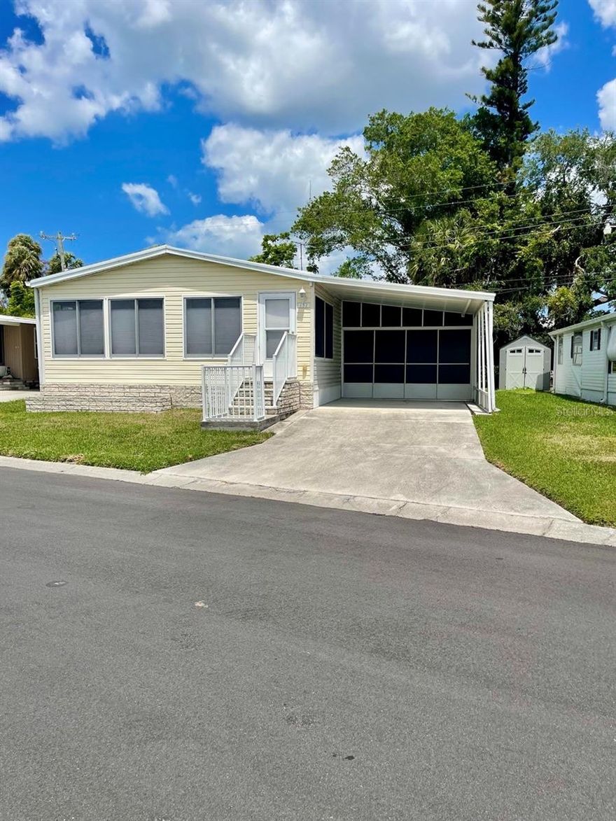 Welcome to your slice of Florida paradise! This beautifully maintained lake view 2-bedroom, 2-bathroom furnished mobile home in the desirable Leisure Lake Co-Op community offers convenience, and easy coastal living. With approximately 1,150 square feet of thoughtfully designed living space, this home is perfect as a full-time residence or seasonal retreat.

Step inside to find a bright and inviting interior, complete with comfortable furnishings and an open-concept layout that seamlessly connects the living and dining areas. The spacious kitchen provides ample cabinetry and counter space, making meal prep and entertaining a breeze.

The primary bedroom features generous closet space and a private en-suite bathroom, while the second bedroom is ideal for guests or a home office. A second full bathroom ensures comfort and privacy for all.

Enjoy your morning coffee or evening relaxation in the Florida room, perfect for taking in Florida’s beautiful weather year-round. Additional highlights include in-unit laundry, covered parking, and extra storage.

Located in the friendly 55+ Leisure Lake Co-Op community in Palmetto, residents enjoy access to amenities such as a clubhouse, heated pool, shuffleboard courts, and a calendar full of social activities. Just a short drive to Gulf beaches, shopping, dining, and medical facilities, this home offers both tranquility and convenience.

Don’t miss this opportunity to own an affordable, move-in-ready home in one of Palmetto’s most welcoming communities!