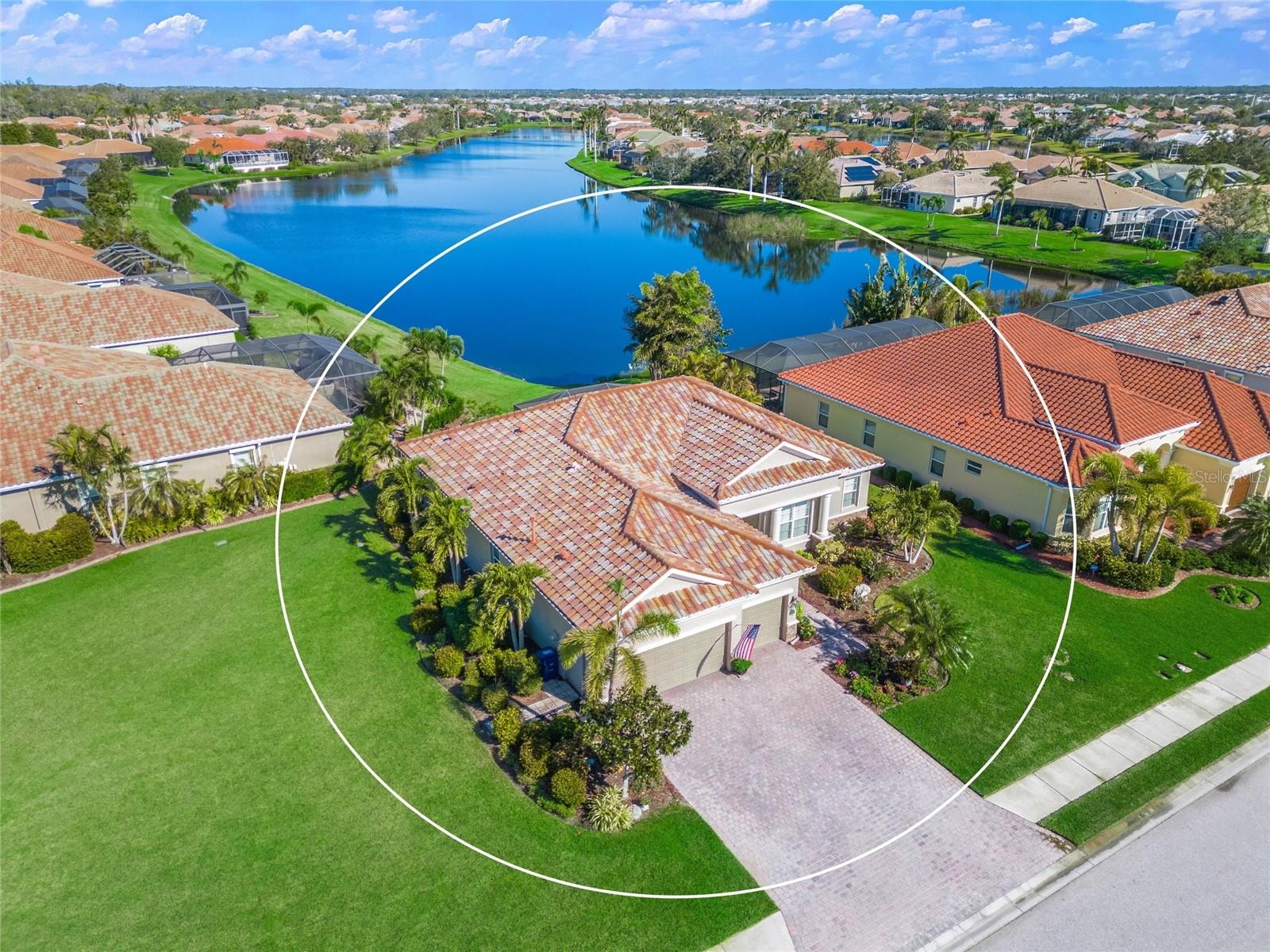 THIS IS THE ONE * COMMUNITY HEATED POOL & SPA + FITNESS CENTER + PICKLEBALL COURTS + CLUBHOUSE * 'A' RATED SCHOOL DISTRICT! Tatum Elementary is less than 2 miles away * FULL HURRICANE PROTECTION will give you PEACE OF MIND with ELECTRIC ROLL DOWN SHUTTERS * The OVERSIZED LOT is almost 1/3 ACRE * Huge Side Yard * LONG, PANORAMIC LAKE VIEWS * The OVERSIZED Covered Lanai with EXTENDED Screen Cage makes for an INCREDIBLE OUTDOOR LIVING AREA * Open Floor Plan * 3 Bedrooms & 2.5 Baths + Den * Great Room * Chef's Kitchen with SPACIOUS Breakfast Nook featuring custom built-ins * GE Profile Appliances, Frigidaire Refrigerator * NATURAL GAS COOK-TOP * CUSTOM WOOD CABINETS & GRANITE COUNTERTOPS * Kitchen is open to the Great Room * The Primary Suite is a true retreat with a separate sitting area and a Spa-style Bath with dual vanities, a walk-in closet, a walk-in shower, garden tub and NEW QUARTZ COUNTERS * Guest Bathroom also has NEW QUARTZ COUNTERS * 3rd Bedroom has a Half Bath * Den/Office DOES have a closet * This home features MANY UPGRADES including Tray Ceiling, Crown Molding, Plantation Shutters, NEW Paint inside and out * Split Plan Design * Barrel Tile Roof * PRIDE OF ORIGINAL OWNERSHIP SHOWS * Irrigation System with Reclaimed Water * RARELY AVAILABLE in GATED LAUREL LAKES * Amenities include: Clubhouse, Fitness Center, Pickleball Courts, Community Pool and LOW HOA fees * NO CDD * Country feel yet minutes to Siesta Key Beach, shopping & dining, EXCELLENT A-RATED SCHOOLS, Rothenbach Park, and the new Publix shopping plaza is just 5 minutes away * One look & you'll fall in love with this immaculate home * GATE CODE REQUIRED FOR SHOWINGS *