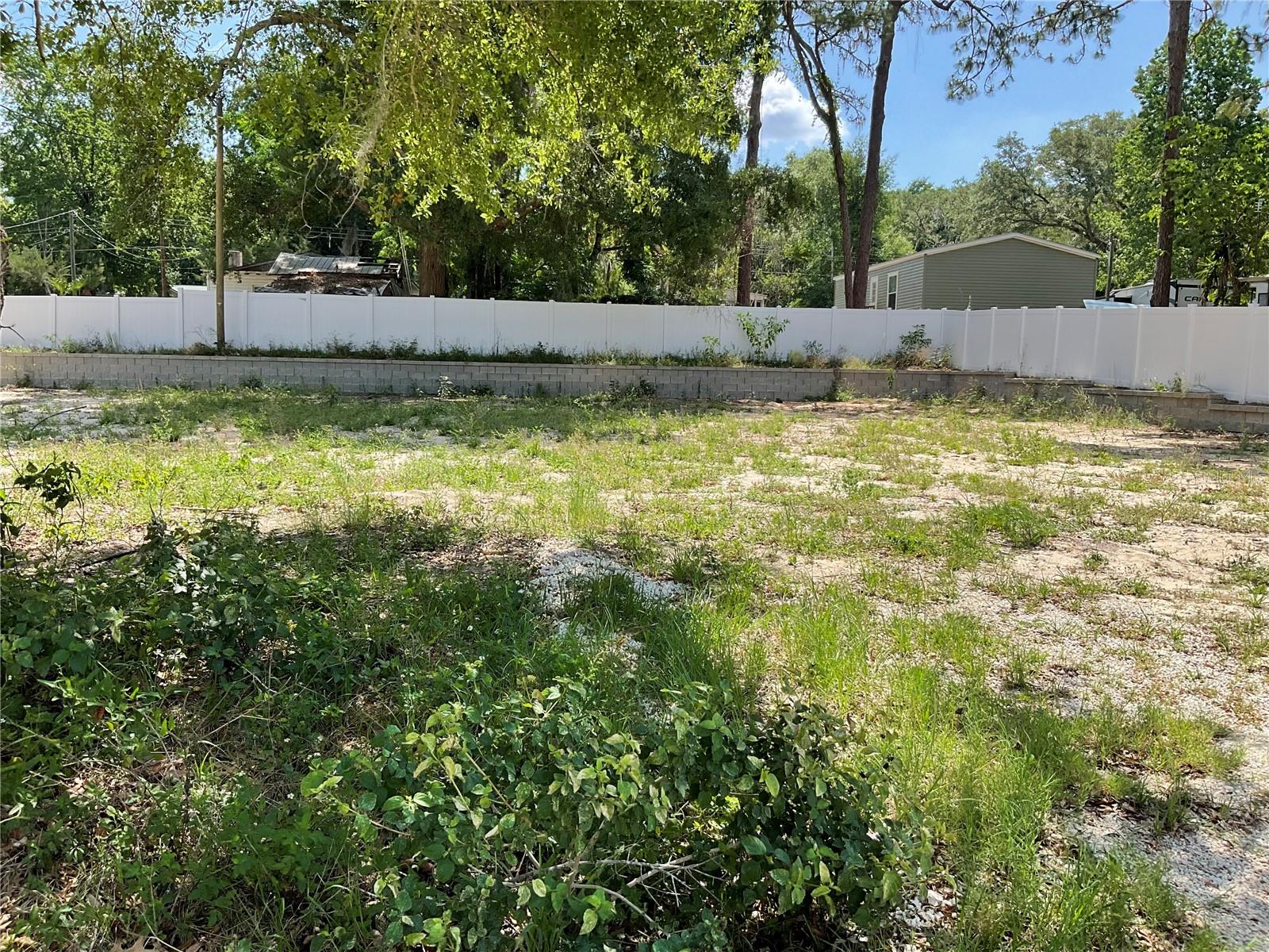 Discover this fantastic lot, perfect for your new Mobile, modular or site-built home. The property features brand-new vinyl fencing, a durable retaining wall, survey and a certified well (needs pump and tank) already in place—saving you time and money. Enjoy private access to beautiful Smith Lake, ideal for boating, fishing, or relaxing by the water. Best of all, there are no HOA fees! Don’t miss this rare opportunity to create your ideal retreat with essential utilities already on site.
