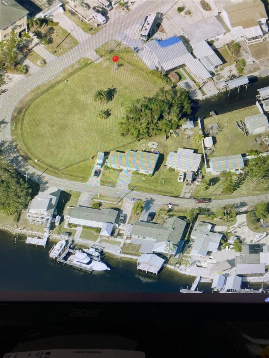 Come see this wonderful corner property with 3 lots and CANAL access. All fenced in clean and clear enjoy the Sea breeze. Build your dream home or that Rental business to grow your portfolio. This 3 lots are to be sold as 1, listing price reflects all 3 lots.