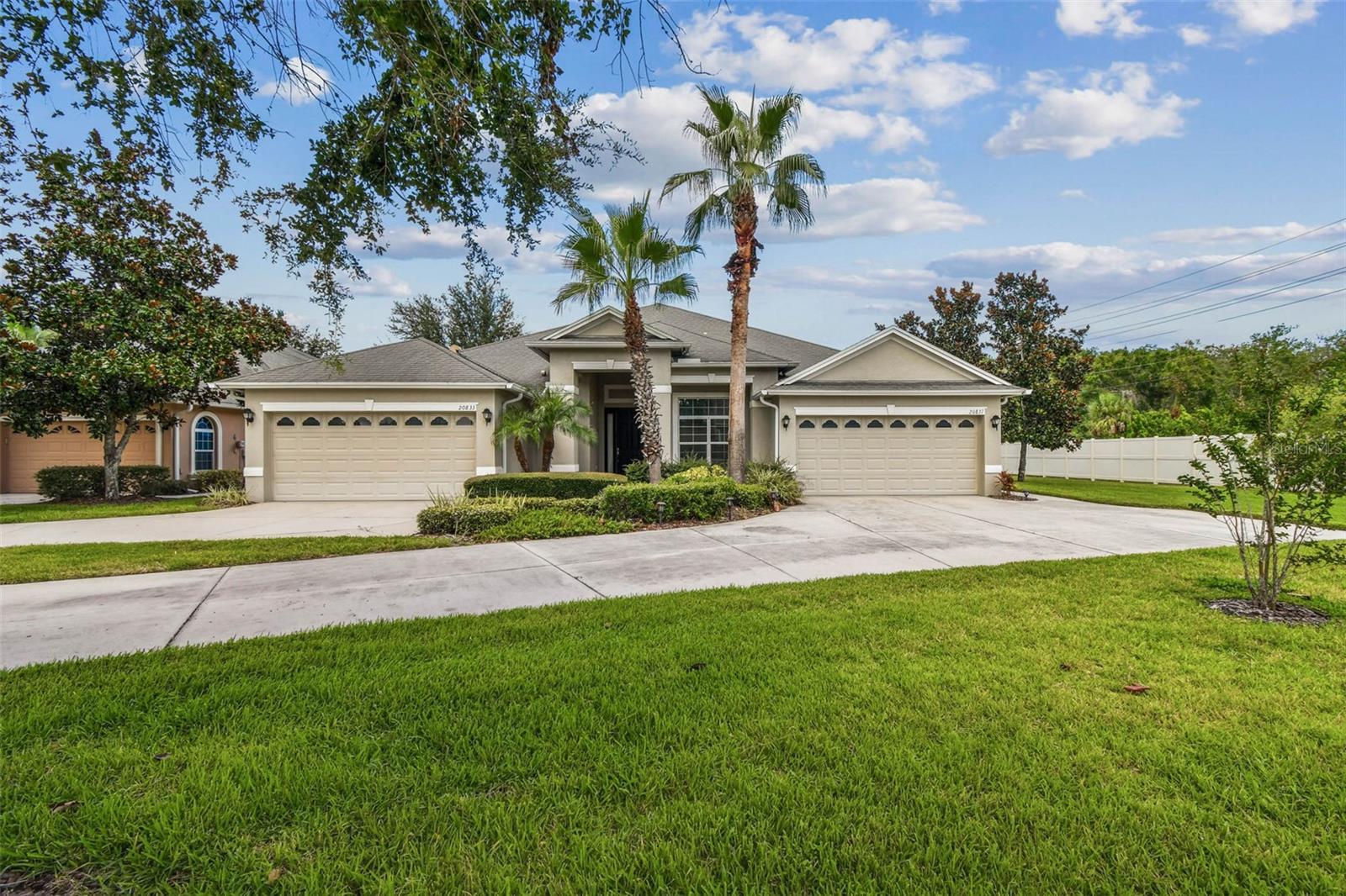 This beautifully maintained villa is set on an oversized 0.41-acre homesite—one of the largest in the community—offering unmatched privacy and space in a prime location between US-41 and SR-54. Inside, a bright and open floor plan showcases 12-foot ceilings, tile flooring in the main living areas, and a seamless flow ideal for both everyday living and entertaining. The chef’s kitchen features granite countertops, a walk-in pantry, and brand-new LG and GE stainless steel appliances, opening directly to the living and dining spaces. A formal dining room provides versatility for hosting gatherings or holidays. The primary suite serves as a private retreat, complete with dual vanities, a spacious walk-in shower, and a large walk-in closet. The secondary bedroom offers cozy carpet flooring and abundant natural light, while the den/office can easily serve as a third bedroom if desired. Step outside to a screened patio overlooking the expansive, fully fenced backyard—perfect for relaxing or entertaining. Additional highlights include a two-car garage, extended driveway with ample parking, and an indoor laundry with washer and dryer included. Enjoy peace of mind with HOA benefits covering the roof, exterior paint, and exterior maintenance. Situated close to shopping, dining, and major highways, this property delivers low-maintenance living with rare extra space not often found in villa communities. Don’t miss your opportunity to call this stunning villa home—schedule your private showing today!