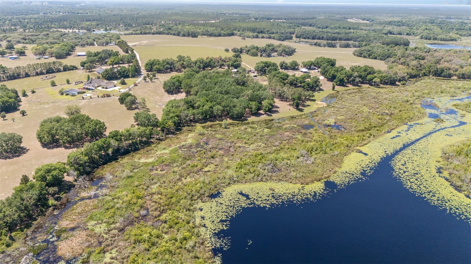 Ten acres of tranquility on Ella Lake – build your dream retreat! Discover a blend of natural beauty and peaceful seclusion with this stunning 10-acre parcel featuring mature oak trees and direct frontage on serene Ella Lake. Whether you’re dreaming of building a custom home, a weekend getaway or an investment for the future, this property offers an unparalleled setting to make it a reality. Towering oaks provide shade, privacy and character, while the lakefront access invites you to enjoy kayaking, fishing or simply soaking in the tranquil views. The land offers a mix of cleared and wooded areas, giving you flexibility in your build site while preserving the natural charm. Deed restrictions are in place, no mobile homes are permitted. This is an ideal location for those seeking a peaceful, nature-inspired lifestyle without sacrificing accessibility. Tucked away just enough to offer a sense of retreat, yet within a reasonable drive to nearby towns, shopping and essential amenities, this property strikes a balance between privacy and convenience. With abundant wildlife, quiet surroundings and a strong connection to the outdoors, every day here feels like a breath of fresh air. Whether you're planning your forever home or securing a legacy property to pass down through generations, this is land worth holding onto.