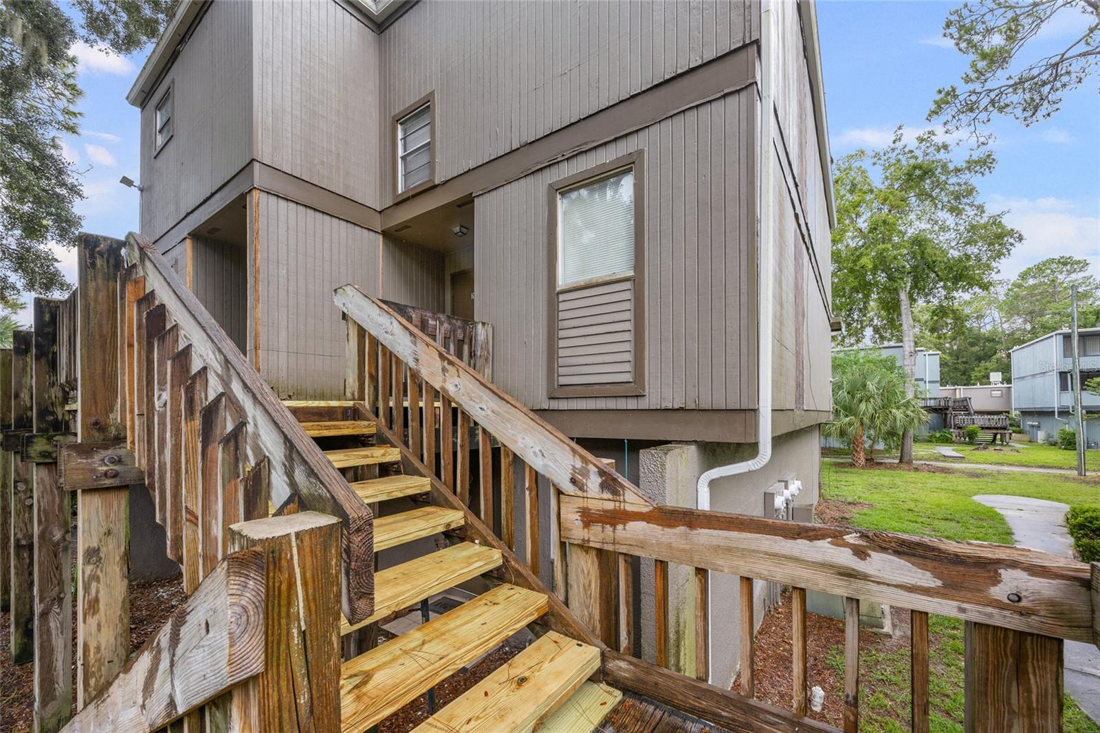 Welcome to this cozy and affordable 1-bedroom, 1-bathroom condominium, nestled in Sparrow, one of Gainesville's character-rich locations. Perfect as a place to call home or a smart investment property, this unit offers a unique blend of vintage appeal and comfort. Step inside to a spacious living area where high ceilings and exposed wooden beams immediately catch your eye, enhancing the feeling of generous space. Large windows invite abundant natural light, creating a warm and inviting atmosphere. The loft bedroom provides ample space and closet storage for all your belongings. You'll appreciate the benefit of a well maintained HVAC system, replaced in November 2020, offering peace of mind, as well as recently replaced carpet. The location is incredibly convenient, with easy access to public transportation, shopping, and everyday necessities. It's a quick zip of 5 minutes to I-75 access. This fantastic opportunity is ready for you. While cash offers are welcome, this unique neighborhood also qualifies for several low money down portfolio loan options, making ownership even more accessible. If you're looking for affordable Real Estate, manageable taxes, & overall a "good value", this is a solid option to strongly consider.
