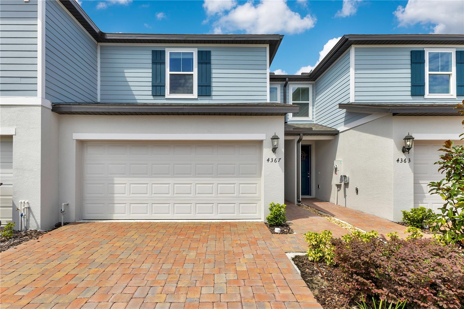 Welcome Home! This move-in ready, Townhouse offers the perfect blend of modern design, comfort, and efficiency. Built in 2024, this energy-efficient 3-bedroom, 2-bath home showcases a spacious open-concept layout filled with natural light and contemporary finishes. The kitchen is both stylish and functional, featuring quartz countertops, stainless steel appliances, 36” upper cabinets with crown molding, and brushed nickel hardware—perfect for everyday living or entertaining. The private primary suite includes a walk-in closet and a beautifully appointed en-suite bathroom. Additional highlights include a two-car garage, extended driveway parking, and modern lighting fixtures throughout. Don’t miss the opportunity to make this well-maintained property your place to live and enjoy—schedule a private tour today