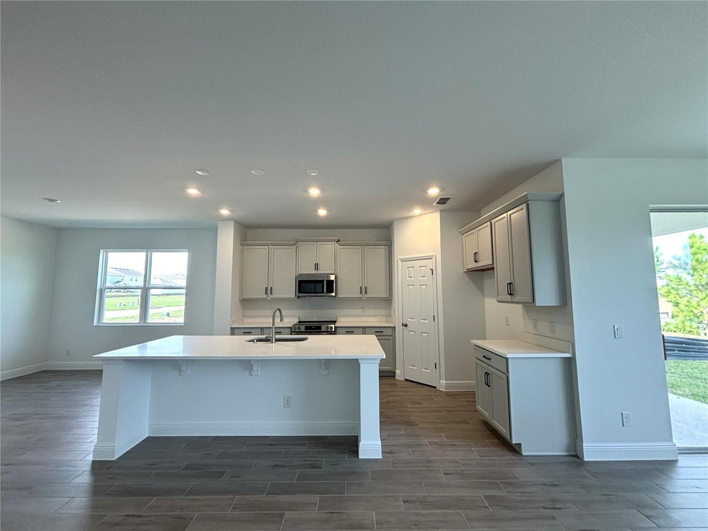 Photo of 7252 Rolling Leaf Road, Groveland, FL 34736 (MLS # O6448209)