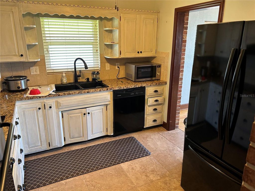 Photo of 21 Paradise Lane, Treasure Island, FL 33706 (MLS # TB8462603)