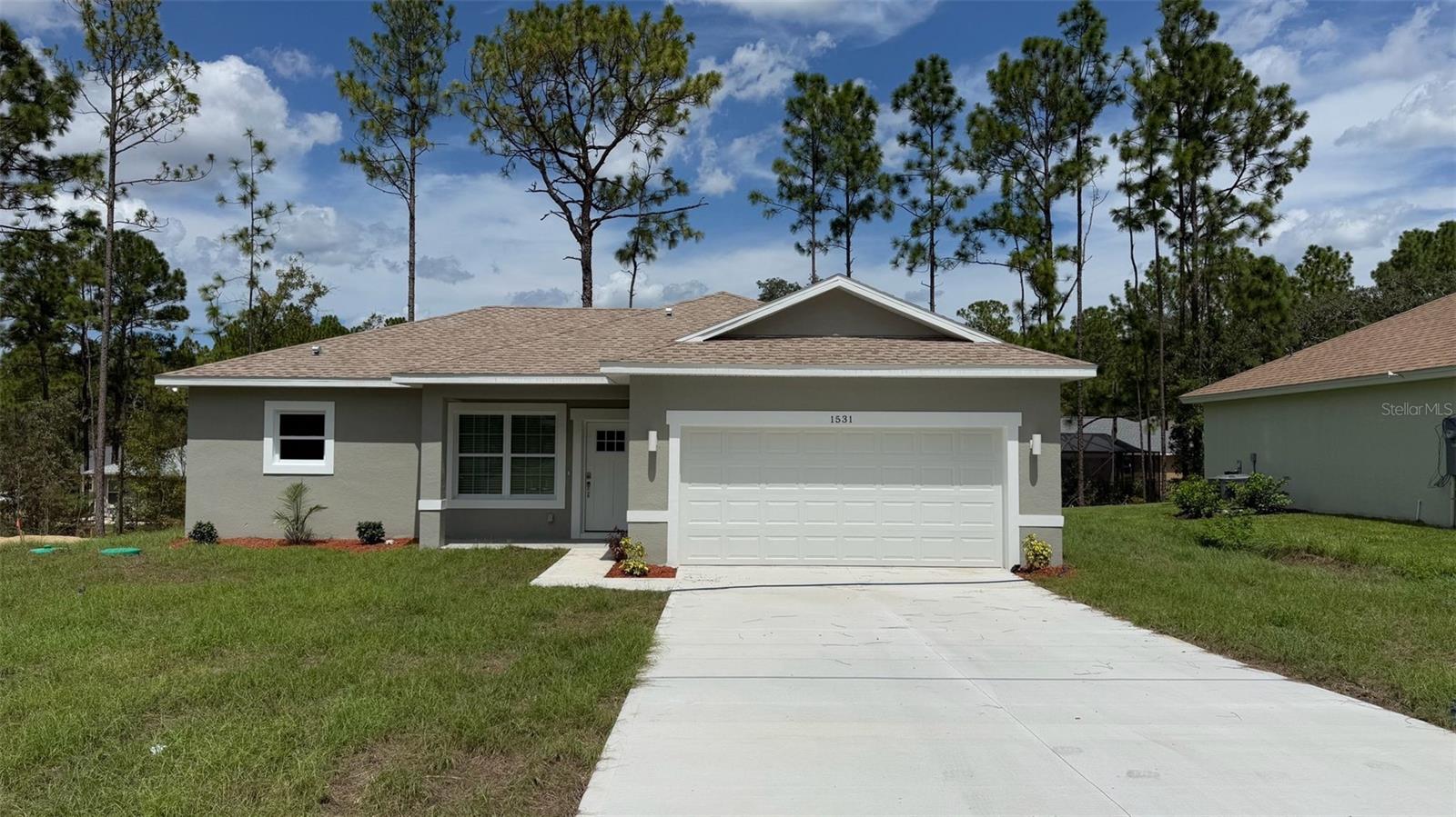 Brand-new house in Citrus! This stunning home combines modern style and convenience with 4 bedrooms and 2.5 bathrooms. The master bathroom is a true retreat, featuring a sleek SHOWER DOOR for added style and functionality. The spacious open floor plan is perfect for hosting large family gatherings, and the fully equipped kitchen includes stainless-steel appliances—refrigerator, range, disposal, dishwasher, and microwave, along with a stylish QUARTZ WATERFALL ISLAND that adds a touch of elegance. Additional features include a SMART KEY system for enhanced security and the peace of mind that comes with a 2-10 HOME BUYERS WARRANTY. Exclusive savings for your buyers! By using On Target Mortgage, our preferred lender, they can receive up to $1,000 in additional Lender closing cost credits towards their appraisal and credit report. To qualify, they must apply with On Target Mortgage, ask me how and maximize their savings! Don’t miss out—schedule a showing today!