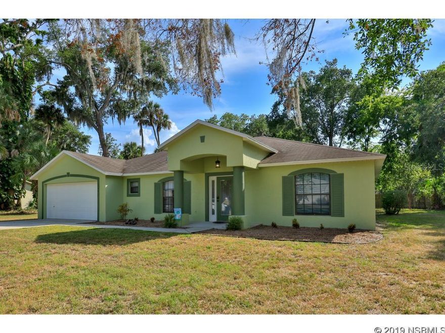 Welcome Home! Come take a look at this spacious concrete block home on a double sized corner lot! The covered front patio invite you in to the wide open floor plan. The formal dining room boasts a pleasing two toned color palette and a crisp white chair rail. The rich tone of beautiful new wood laminate floors carry throughout the living areas and bedrooms. The heart of this home is the generous sized kitchen with large island & breakfast bar. The kitchen has a double pantry, an eat-in area and overlooks the open living room as well. The utility room is convenient to both kitchen and 2 car garage with full size stacking washer & dryer (included!) and a half bath. The huge master bedroom easily accommodates a seating area or an office nook. The en suite bathroom has a shower, garden tub and a large vanity with room for a vanity seat. Three generous bedrooms are split to the other side of the home, along with the guest bathroom.  A/C is 2018 and there is also has a brand new tankless hot water heater for energy efficiency.  Outside you will find mature shade trees gracing the property with tons of space for outdoor living. Lots of choices for whatever is important to you - a screened porch, pool, shop, play set or a spot to park your RV, boat or other toys.  You must see this home today! ;Water: City