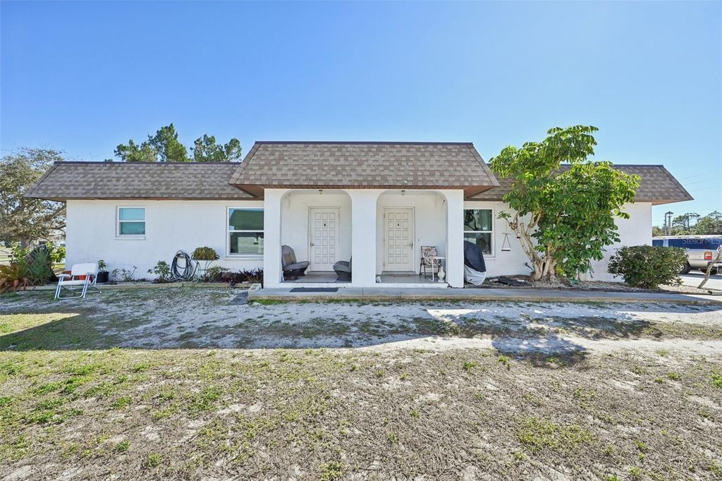 Photo of 124 Boundary Boulevard, Rotonda West, FL 33947 (MLS # TB8469016)