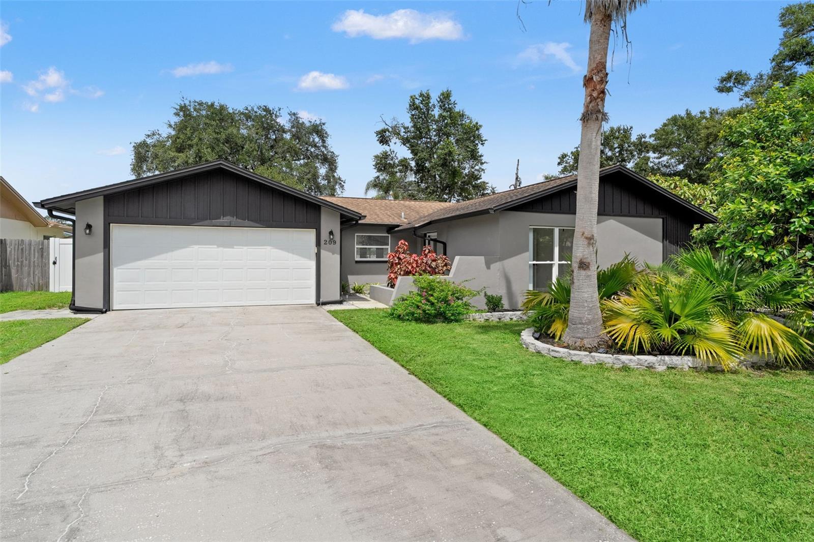 Beautifully updated 3-bedroom, 2-bath, 2-car garage home in the heart of Safety Harbor with 1,449 sq. ft. of living space. The kitchen is a chef’s delight, featuring Whirlpool stainless steel appliances, a deep chef’s sink, white quartz countertops, and a large pantry. Bathrooms have been upgraded with Carrera marble and quartz vanities, while the master suite includes a walk-in closet and spa-like bath with walk-in shower.
Interior highlights include hardwood floors in the living room, skylight, ceiling fans throughout, reverse osmosis water filtration system, water softener, and LVT flooring with a lifetime warranty. Multiple new windows, a new sliding door, and marble windowsills bring in light and style. Formal dining opens to a private fenced backyard with a wood deck and new side fencing, plus sandblasted marble pavers for outdoor enjoyment.
The home also features a completely renovated designer garage with liquid granite flooring, maple cabinetry, pantry surface, work surface, and ample storage. Freshly painted inside and out, this home is move-in ready.
Located in a quiet dead-end community, just a golf cart ride from downtown Safety Harbor—where you’ll find Third Friday festivals, fantastic restaurants, and boutique shops—this property combines convenience, charm, and modern upgrades.
