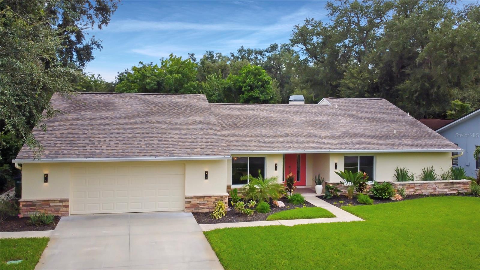 1820 Pine Hill Dr – Safety Harbor, FL
Welcome to Rainbow Farms North, where this beautifully remodeled 4-bed, 3-bath home captures the best of Florida living. From the moment you pull up, the fresh landscaping and clean, modern curb appeal set the tone for what’s inside.
Step through the front door and into an open, sun-filled floor plan. Vaulted ceilings, a stunning stone wood-burning fireplace, and walls of natural light create a warm, inviting space that feels both spacious and comfortable. Newly updated High-end wood-look tile flooring and designer fixtures run throughout, giving the home a sleek, cohesive style.
At the heart of it all is the chef’s kitchen—KraftMaid cabinetry with pull-outs, custom storage, and modern appliances flow seamlessly into the dining and living areas, making it the perfect spot for cooking, gathering, and entertaining.
The primary suite is your private retreat, complete with a spa-like bath featuring a soaking tub, walk-in shower, dual vanities, and rich cabinetry. With its split bedroom design, the layout balances privacy and comfort, whether for family, guests, or multigenerational living.
Step outside and you’ll find your own tropical escape. A heated saltwater pool invites year-round enjoyment, while the fully fenced yard keeps pets safe and adds peace of mind. The screened lanai sets the stage for dining, lounging, or cozy nights by the fire table. Beyond the pool, a private putting green along the creek—complete with night lighting—adds a one-of-a-kind touch, complemented by professional landscape lighting that makes the entire backyard glow.
Other thoughtful details include newly updated hurricane-rated Impact windows and doors, a finished garage with durable epoxy flooring and custom cabinetry, and countless updates that make this home truly move-in ready.
Adding to the lifestyle, Safety Harbor is a golf cart–friendly community, and this home offers golf cart access straight into charming downtown Safety Harbor, where you’ll find local shops, dining, and waterfront views.
All of this is just minutes from the bay, Tampa International Airport, and Gulf beaches. It’s a perfect blend of luxury, comfort, and convenience—everything you want in a Florida lifestyle. Homes like this don’t come along often. See it for yourself. Schedule your showing today and discover your private retreat in Safety Harbor.