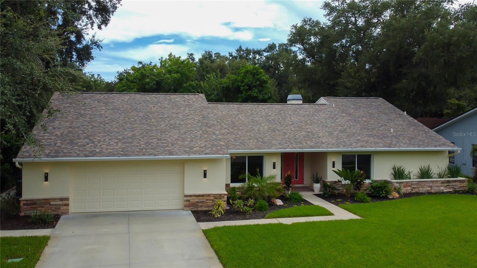 1820 Pine Hill Dr – Safety Harbor, FL
Welcome to Rainbow Farms North, where this beautifully remodeled 4-bed, 3-bath home captures the best of Florida living. From the moment you pull up, the fresh landscaping and clean, modern curb appeal set the tone for what’s inside.
Step through the front door and into an open, sun-filled floor plan. Vaulted ceilings, a stunning stone wood-burning fireplace, and walls of natural light create a warm, inviting space that feels both spacious and comfortable. Newly updated High-end wood-look tile flooring and designer fixtures run throughout, giving the home a sleek, cohesive style.
At the heart of it all is the chef’s kitchen—KraftMaid cabinetry with pull-outs, custom storage, and modern appliances flow seamlessly into the dining and living areas, making it the perfect spot for cooking, gathering, and entertaining.
The primary suite is your private retreat, complete with a spa-like bath featuring a soaking tub, walk-in shower, dual vanities, and rich cabinetry. With its split bedroom design, the layout balances privacy and comfort, whether for family, guests, or multigenerational living.
Step outside and you’ll find your own tropical escape. A heated saltwater pool invites year-round enjoyment, while the fully fenced yard keeps pets safe and adds peace of mind. The screened lanai sets the stage for dining, lounging, or cozy nights by the fire table. Beyond the pool, a private putting green along the creek—complete with night lighting—adds a one-of-a-kind touch, complemented by professional landscape lighting that makes the entire backyard glow.
Other thoughtful details include newly updated hurricane-rated Impact windows and doors, a finished garage with durable epoxy flooring and custom cabinetry, and countless updates that make this home truly move-in ready.
Adding to the lifestyle, Safety Harbor is a golf cart–friendly community, and this home offers golf cart access straight into charming downtown Safety Harbor, where you’ll find local shops, dining, and waterfront views.
All of this is just minutes from the bay, Tampa International Airport, and Gulf beaches. It’s a perfect blend of luxury, comfort, and convenience—everything you want in a Florida lifestyle. Homes like this don’t come along often. See it for yourself. Schedule your showing today and discover your private retreat in Safety Harbor.