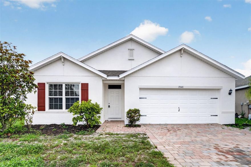 Welcome to this beautifully maintained 4-bedroom, 2-bath home located in the gated community of Marblebrook. This home features a brick paver driveway and entry, fresh interior and exterior paint, a NEW ROOF, pond views from the living room, dining area, and primary bedroom, and is not located in a flood zone.

The open kitchen overlooks the living and dining areas and includes a center island with sink, bar seating, walk-in pantry, and brand-new stainless steel appliances including a side-by-side refrigerator. Tile flooring runs throughout the main living areas, with brand-new carpet in all bedrooms.

The primary suite includes dual sinks, a walk-in shower, private water closet, large walk-in closet, and additional bathroom storage. Additional features include an inside laundry room, blinds throughout, hurricane shutters in the garage, and a brick paver patio overlooking the pond.