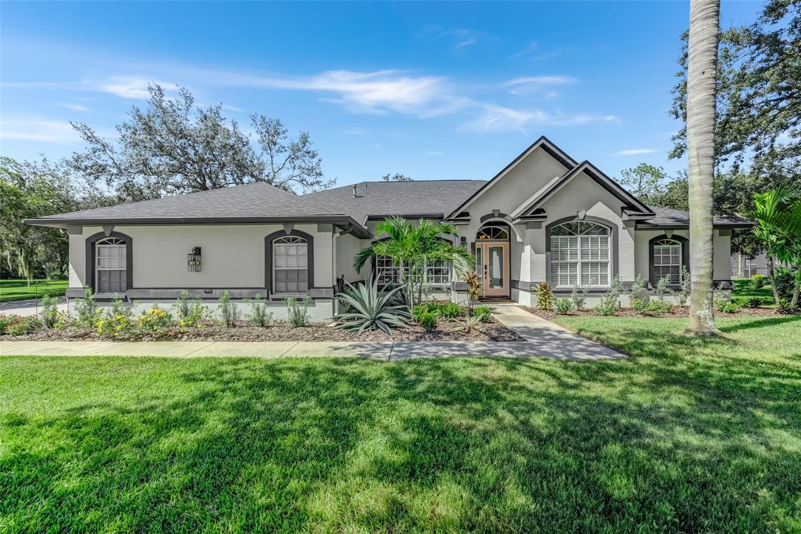 Nestled in the tranquil gated community of Eagle Watch, this stunning 4-bedroom, 3-bath PLUS office executive home offers an unparalleled lifestyle surrounded by nature's beauty. With mature oak trees lining the roads and the soft glow of the Florida sun, this neighborhood offers an unparalleled lifestyle that you'll be proud to call your own. Presenting a truly exceptional 4-bedroom, 3-bath PLUS office executive home on an expansive half-acre lot, this is truly a rare opportunity to seize.
Prepare to be captivated as you step inside this meticulously redesigned home, where every detail has been thoughtfully curated. The interior is a harmonious blend of style and functionality, adorned with warm wood cabinetry that emanates modern elegance, complemented by quartz counters and stainless-steel appliances—a testament to the luxury that defines this residence. Just off the kitchen, there is a breakfast nook overlooking the inviting pool, while the cozy family room features a brick fireplace, setting the perfect ambiance for entertaining friends and family.
This home boasts a split floor plan, with two generously sized bedrooms on one side, an in-law suite off the rear of the home, and the master suite on the opposite end. The master suite is a sanctuary, adorned with a beautiful accent wall and a large sliding glass window framing views of the pool and the expansive backyard. The remodeled ensuite combines elegance and functionality, featuring a custom vanity with walnut accents. The large luxurious shower has been updated with limestone tiles and multi-functional shower options.
The backyard is appointed with a large patio space great for accommodating guests and an inviting pool, perfect for unwinding and entertaining, while the lush lawn, nurtured by well water, ensures both beauty and eco-conscious sustainability. Eagle Watch's allure extends beyond the property lines, creating a vibrant community bound by shared passions. Immerse yourself in the community by enjoying walks along the tree-lined roads or engage in a friendly match on the tennis courts. Unwind at the community fire pit, or throw a line in the water off the community dock. Boat enthusiasts will revel in seamless access to the Alafia River. The community has its own private boat ramp, community day slips, or you can rent a boat lift. The clubhouse is the perfect meeting spot to enjoy a Sunday on the water, or you can just bask in the sun by the community pool overlooking the Alafia River.
Seize the opportunity to own an exquisite pool home within this coveted gated community. Don't miss your chance to embrace the lifestyle you deserve—schedule your private tour today and experience firsthand the irresistible allure of Eagle Watch living!
