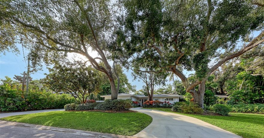 Don’t miss this opportunity to own a “West of the Trail” home in one of Sarasota’s most
sought-after neighborhoods on a tree-lined quiet street. This three-bedroom residence
features a desirable split-bedroom floor plan and a spacious living room that opens to a
screened, caged swimming pool surrounded by brick pavers--perfect for indoor/outdoor
living. The home also offers a comfortable family room with a wood-burning fireplace, a
separate dining room with access to a paved backyard patio, and a breakfast bar that
connects to the gally-style kitchen. Abundant storage and closet space galore can be
found throughout, including built-in cabinetry in the primary bedroom and family room.
Roof and water heater were replaced in 2016, pool pump/filter and pool sweep replaced in
2024. The home’s excellent curb appeal is highlighted by mature oak trees, lush tropical
vegetation, blooming azaleas, and a circular driveway plus a two-car garage which
provides additional storage. This inviting property offers both charm and functionality – an
ideal place to call home.