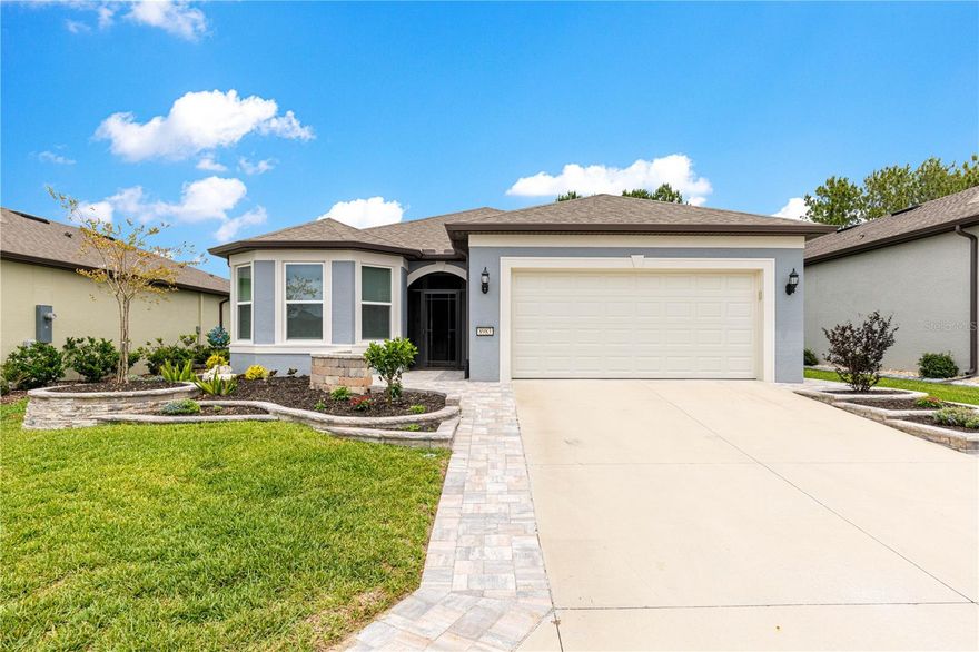 Nestled in the highly sought-after Stone Creek community, this exceptional home in the Bridlewood neighborhood offers breathtaking golf course views and complete privacy overlooking the 13th green. Beautifully landscaped and thoughtfully upgraded throughout, this 2,132-square-foot residence combines elegance, comfort, and functionality in every detail. Featuring 3 spacious bedrooms, 3 full bathrooms, and a versatile flex room ideal for an office, hobby room, or additional guest space, the home boasts soaring ceilings, neutral designer tones, and stunning luxury vinyl plank flooring throughout the main living areas. The coffered ceiling in the living room is accented with crown molding, creating a sophisticated yet inviting atmosphere. The gourmet kitchen is truly the heart of the home, showcasing gorgeous gray-brown Level 3 cabinetry with soft-close drawers and pull-out shelving in the lower cabinets for maximum convenience. Culinary enthusiasts will appreciate the premium GE Monogram induction range and the open layout designed for entertaining and everyday living alike.The luxurious primary suite features a custom-designed Elfa closet system and a beautifully appointed bathroom complete with a walk-in shower and dedicated vanity area. A private ensuite guest bedroom provides the perfect retreat for visitors. Step outside to enjoy the expansive covered lanai and additional patio space, ideal for entertaining or simply relaxing while taking in  the peaceful golf course setting. The fenced backyard offers privacy and room for pets or outdoor enjoyment .Additional highlights include: Large laundry room with utility sink, storage cabinetry, and folding table, coated and insulated garage, wall-mounted tool storage racks in the garage, water softener system, and impeccable landscaping and curb appeal. This stunning home offers the perfect blend of luxury upgrades, practical features, and serene golf course living in one of Ocala’s premier active adult communities. Residents of Del Webb Stone Creek enjoy an array of amenities, such as a resort style pool, two clubhouses, fitness center, a golf course, and a plethora of clubs and interest groups. It is a vibrant active 55plus community