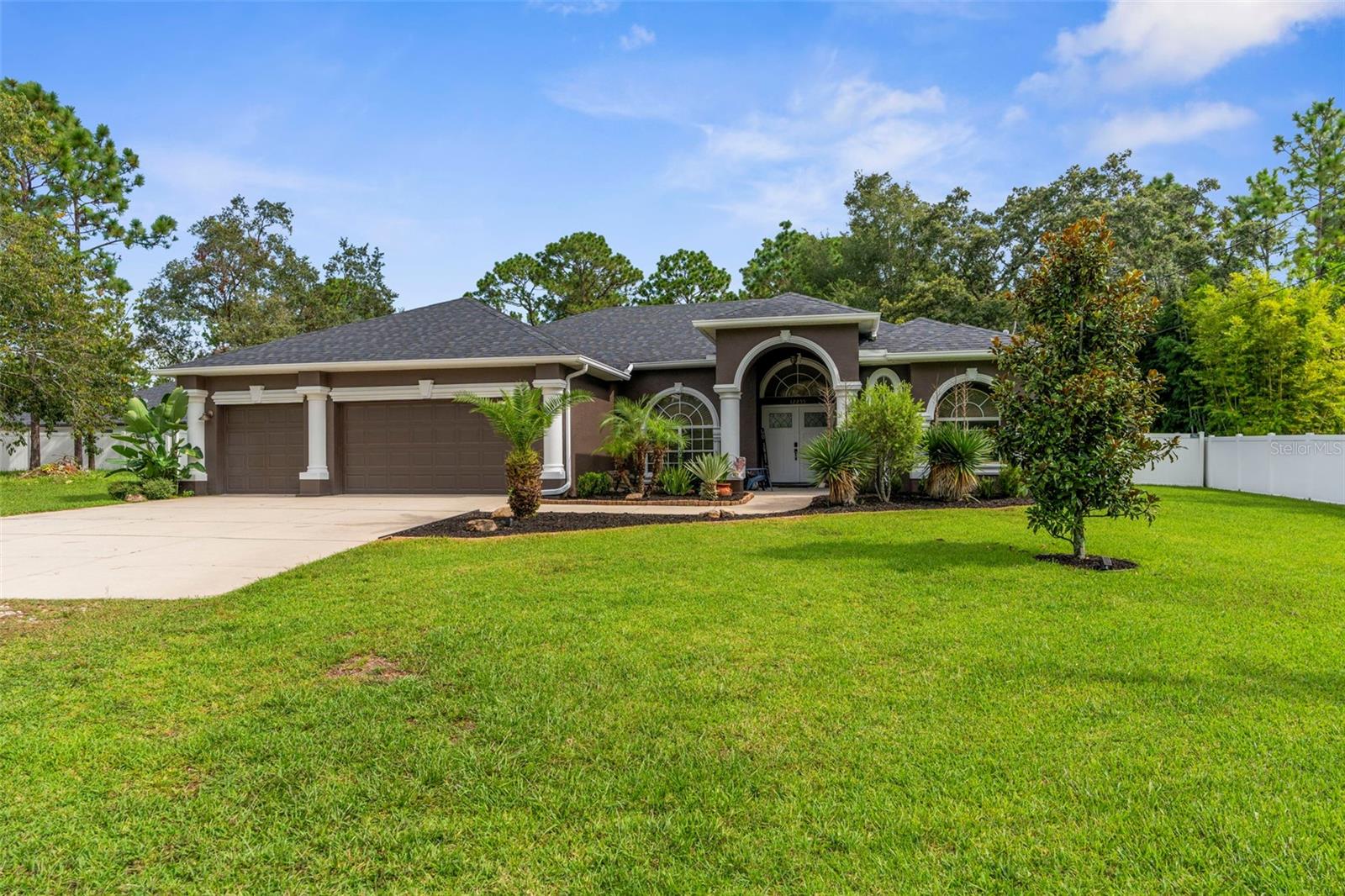 ASSUMMABLE VA loan (for Veterans only) with a fixed 4.75% interest rate. Buyer would need to be approved with current mortgage servicer. Welcome to this beautifully updated 3-bedroom, 2-bath home with a 3-car garage, perfectly situated on a spacious .50-acre corner lot with no HOA or CDD fees. This home features a desirable split floor plan with tile flooring throughout, offering both style and easy maintenance. The laundry room is right off the kitchen, featuring an "open pantry" for additional storage. The kitchen and living spaces flow seamlessly, creating a warm and inviting atmosphere for everyday living and entertaining. There is a flex space that can be used as an office, den, or even a formal dining room. Recent upgrades include a brand-new roof and stunning new double front doors that add curb appeal and peace of mind. Step outside and enjoy your own private retreat — complete with a large shed, an above-ground pool with deck, a dog run, and plenty of yard space for outdoor living, gardening, and entertaining. With ample parking, storage, and freedom to make the property your own.