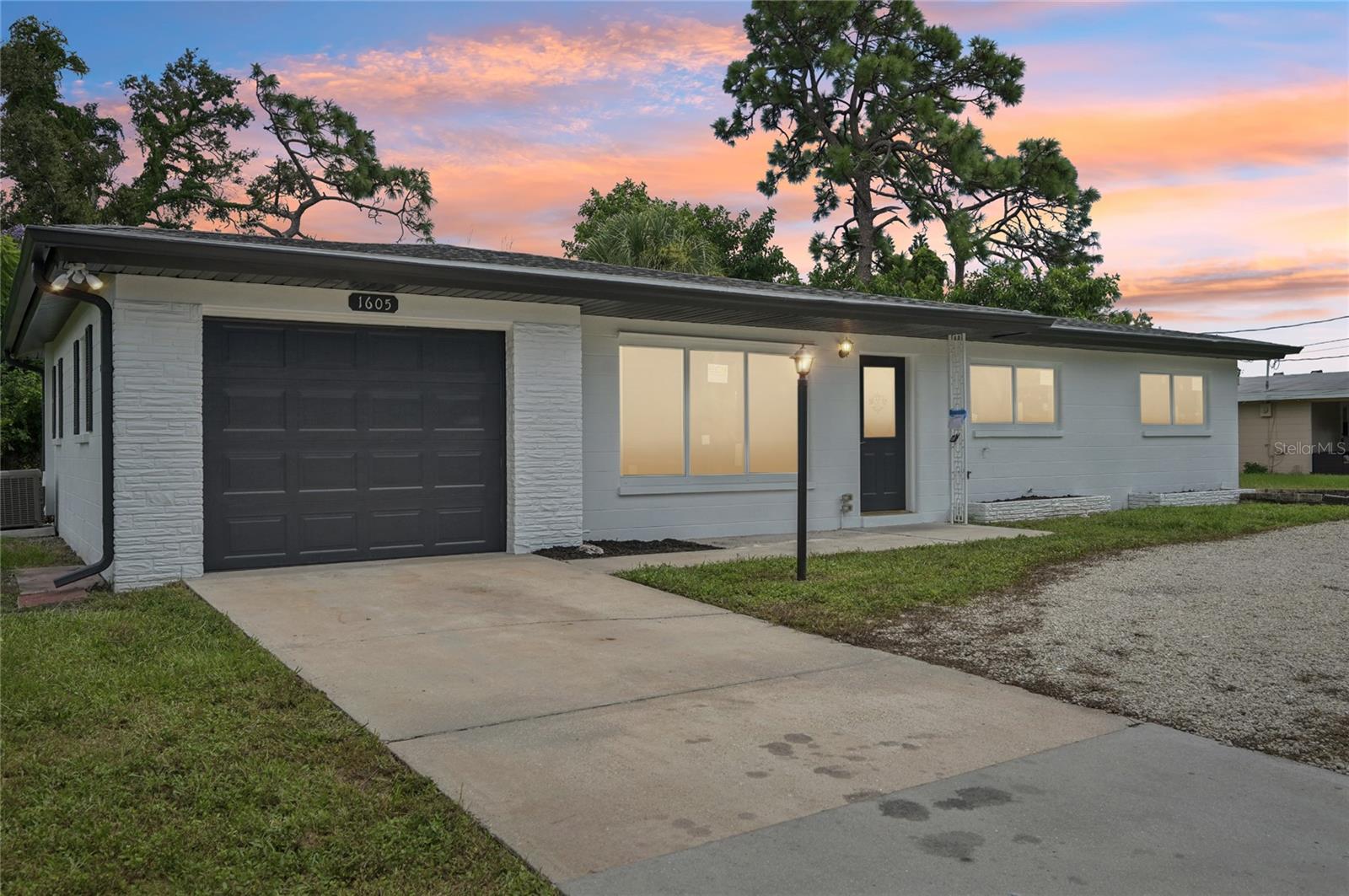 Welcome to this beautifully remodeled 3-bedroom, 2-bathroom home in the heart of Venice! Step inside to find a light-filled open floor plan showcasing white shaker cabinetry, quartz countertops, recessed lighting, and brand-new stainless-steel appliances. Freshly painted inside and out, the home features new trim work, brand-new hurricane impact windows and doors, a newer roof, and A/C for peace of mind.
Both bathrooms have been tastefully updated with modern tile, sleek vanities, and matte black fixtures, while the bedrooms offer comfort with new carpet. Situated on a spacious ¼-acre lot with NO HOA, NOT IN FLOOD ZONE, this property provides plenty of room to relax or entertain. Centrally located near Venice’s beautiful beaches, shopping, dining, schools, and community events, this home combines style, comfort, and convenience—ready for you to move in and enjoy the Florida lifestyle!