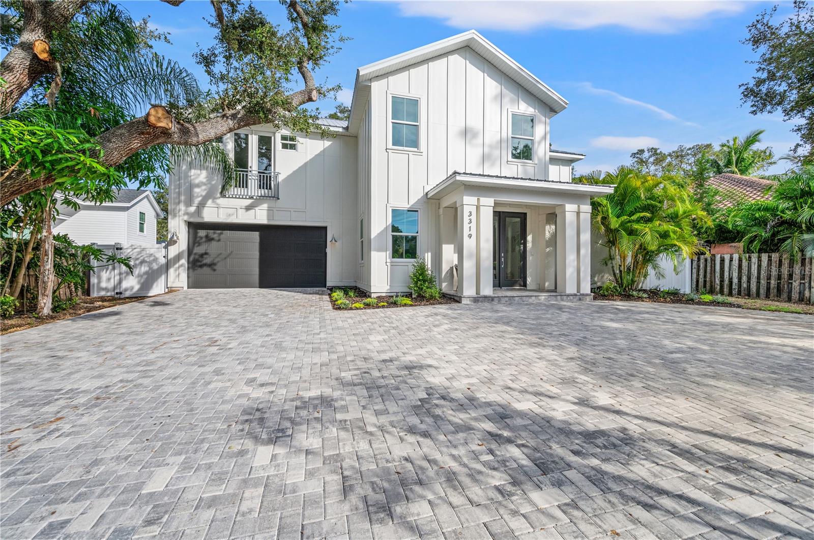 Welcome to this stunning 2-story luxury home developed by M&J Pham Development, featuring 4 bedrooms, 4.5 bathrooms, and 3,423 square feet of living space. From the moment you step inside, you'll be captivated by the open floor plan, high-end finishes, and fantastic design. The home features a modern and elegant kitchen with top-of-the-line Viking appliances, quartz countertops, and custom cabinetry. A large patio with an outdoor kitchen seamlessly blends indoor and outdoor living with meticulously planned landscaping and pool area. The master bedroom of this home is a true sanctuary, offering a plush and peaceful retreat after a long day. It boasts an ample layout with plenty of room, and large windows to let in unrestricted natural light, providing a bright and airy feel that's perfect for relaxation. The room also features a generously sized walk-in closet with abundant space for storage and organization as well as a sliding door for you to easily enjoy the outdoor scenery. The master bathroom is equally impressive, featuring a soaking tub and a separate shower that's great for unwinding after a long day. The opulent finishes and high-end materials used throughout the space add to the feel of this spectacular master suite, making it the best place to recharge and rejuvenate. As you ascend the grand staircase to the upper level of the lavish estate, you are met with a breathtaking sight of three cozy bedrooms. Each of the three bedrooms are spacious, and private, with its own bathroom. This setup is perfect for families or groups of friends looking to stay together in comfort and convenience. Situated between Siesta Key and Downtown Sarasota, you will have easy access to some of the best beaches, restaurants, and shopping that Sarasota has to offer. Whether you are looking for a day at the beach, a night out on the town, or a quiet evening at home, this home has everything you need.