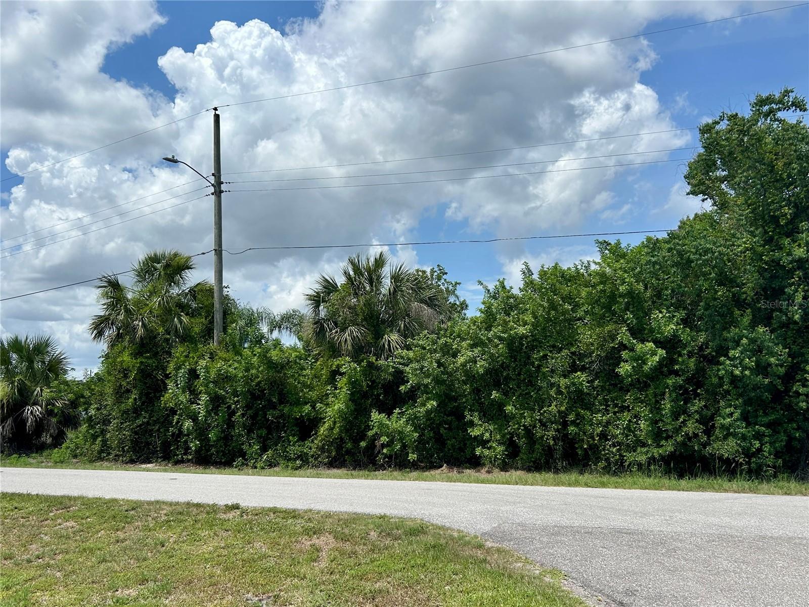 Nestled in the tranquil Harbour Heights community of Punta Gorda, this exceptional canal-front lot offers direct sailboat access to Charlotte Harbor and the Gulf of Mexico. Community amenities (1.1 miles away) include the newly upgraded Harbour Heights Park, where residents enjoy amenities such as a public boat ramp, day docks, pavilion, tennis courts, shuffleboard, park setting, and a playground. Conveniently situated near I-75, this property offers easy access to Fort Myers, Punta Gorda, Venice, Naples, and is only 15 minutes from Punta Gorda Airport. Whether you're an avid boater, fisherman, or nature enthusiast, this lot provides the perfect foundation for your waterfront lifestyle. The seller will clear the lot of trees prior to closing, offering you a pristine canvas to design and build your dream home in a tranquil setting.