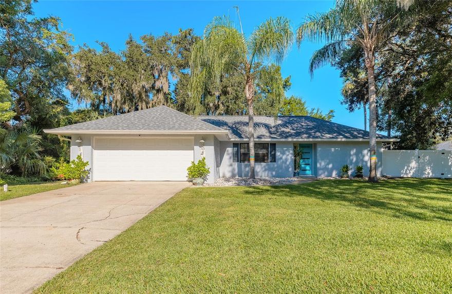 This coastal retreat in the desirable community of Riverwood Plantation is located just 15 minutes from the beach, offering 3 bedrooms, 2 bathrooms, and meticulous upgrades throughout. The kitchen was beautifully remodeled in 2023 and is complemented by new flooring (2023), a new roof (2022), and a newer HVAC system (2018) for long-term comfort and peace of mind. An outdoor shower makes beach days effortless, while the newly fenced backyard (2023) features a smart irrigation system and lush, established landscaping that provides privacy and room to create your ideal outdoor oasis. Indoor and outdoor refrigerators, along with the living room TV, are included. On this side of the neighborhood, HOA membership is OPTIONAL at $268 per quarter. If you choose to join, you gain access to a pool, clubhouse, tennis court, and private neighborhood access to Spruce Creek with a kayak launch and boat ramp, making it easy to explore Florida’s natural beauty just steps from home. Lovingly cared for and full of coastal charm, this property offers the perfect balance of relaxed small-town living and modern comfort in all the right places.