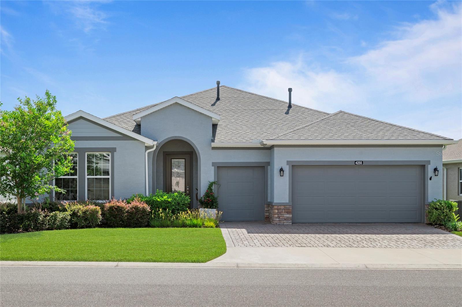 Welcome to the Shea-built Excite model in the sought-after Ocala Preserve, where luxury living meets relaxed resort-style amenities. Built in 2022 and set on nearly a quarter-acre lot, this meticulously maintained home offers 2,017 square feet of thoughtfully designed space, featuring 2 bedrooms, 2 bathrooms, a versatile den, and a golf cart garage. Step inside to find warm wood-look tile flooring throughout the main living areas, paired with plush high-grade carpeting in the bedrooms and den. The heart of the home is the bright, open-concept kitchen, complete with white cabinetry, stone countertops, a massive center island, stainless steel appliances, and a gas stove—perfect for both casual meals and entertaining guests. The spacious primary suite serves as a private retreat with a large walk-in closet and a spa-like bath showcasing dual vanities and a beautifully tiled glass-enclosed shower. The guest bedroom is generously sized, and the secondary bathroom features a shower/tub combo. The den offers the perfect flex space for a home office, craft room, or quiet escape. Living in Ocala Preserve means enjoying one of Ocala’s premier communities, offering a wealth of amenities that make every day feel like a getaway. Residents have access to The Oak House, a stunning clubhouse with a full-service restaurant, fitness center, spa, and social spaces. Enjoy the resort-style pool, lap pool, tennis and pickleball courts, bocce ball, nearly 10 miles of scenic trails, and even a Tom Lehman-designed golf course. Whether you're meeting friends for brunch, kayaking on the lake, or joining one of the many resident-led clubs, there's always something to do. This home offers the perfect balance of comfort, elegance, and an unbeatable lifestyle. Come experience Ocala Preserve—you may never want to leave.