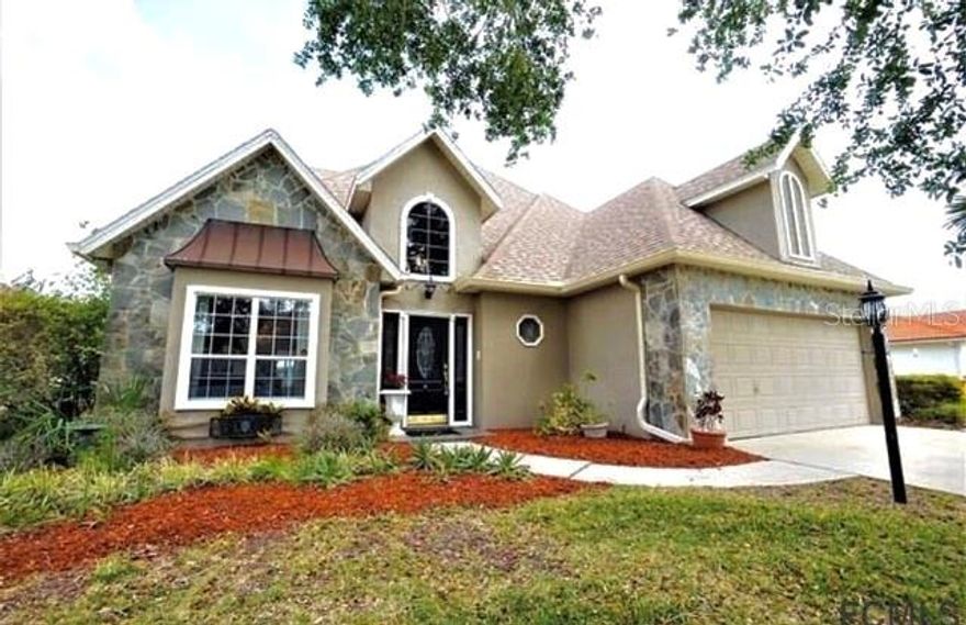 No expense has been spared on this beautifully remodeled waterfront home. From the stunning hard wood floors throughout ,tiled foyer, and elegant chandeliers.
This saltwater canal home is located in the heart of Palm Coast's sailboat country with easy access to the Intracoastal Waterway . A new pool and dock are just a few of the additional upgrades make this a one of a kind home.

An elegant foyer introduces the home's personality and welcomes your guests.  Stunning Formal dining for those special occasions. 
Gourmet Kitchen, for professional and aspiring chefs alike, and for all who desire luxury cooking environments, you've come to the right place.
 Incredible ,spacious Florida Room with sitting room dining area, wet bar, two built in  wine coolers and a retractable projection screen TV .Perfect for entertaining 
1st floor master suite with and attached sitting room overlooking the canal for a quiet place to take in the canal views. 
Large second floor includes  2 bedrooms with builtin bookcases .and a sitting area looking over the living room .
bedrooms.  
This is what waterfront living is all about !  A must see for sure ! ;Water: City