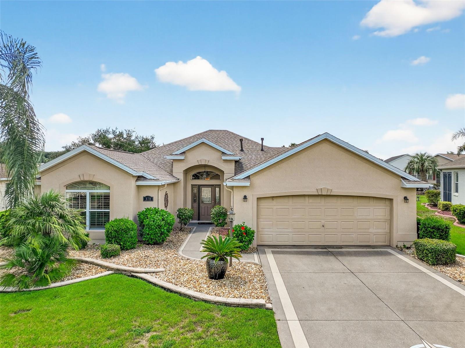 Welcome to this breathtaking LANTANA featuring a VIEW and NO BACK NEIGHBORS. This exquisite property showcases a variety of outstanding upgrades and thoughtful details that make it an ideal place to call home. The mature landscape includes curbing with rocks. Inside, the home is adorned with CROWN MOLDING and a spacious foyer, with tile flooring throughout the living areas. To the left, the hallway leads to two guest bedrooms equipped with ceiling fans and closets, along with a guest bathroom. The Primary bedroom features a tray ceiling, a fan, a walk-in closet, and an en suite bathroom that includes double sinks, a makeup area, a glass walk-in shower, and a toilet closet. The stunning VIEWS from the main living area are peaceful. The kitchen is equipped with ample cabinets, stainless steel appliances, and under-counter lighting. The living room seamlessly transitions into the enclosed LANAI, which boasts large windows for enjoying a 180-degree VIEW. The property’s excellent location in the VILLAGE OF MALLORY provides convenient access to all your needs, including the nearby ODELL Recreation Center, shopping, dining, medical offices, and entertainment at Sumter Landing and Brownwood squares—all just minutes away. Don’t miss the opportunity to own this remarkable home—schedule your private tour today!