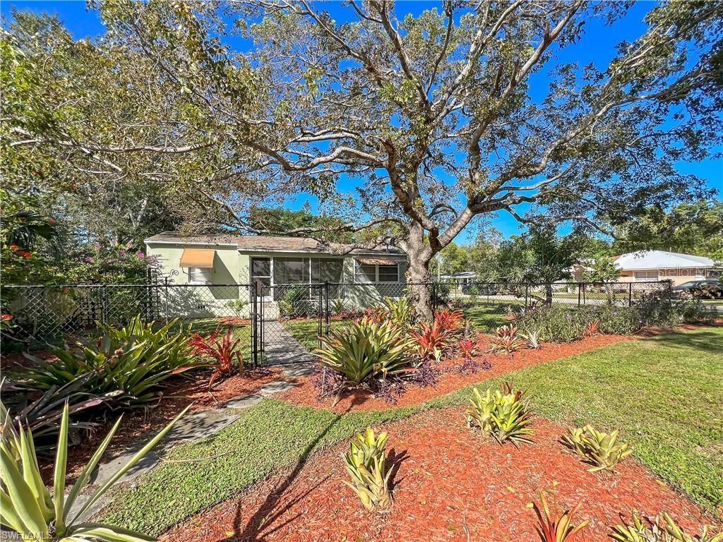 Location! Location! Location! Perfect property for anyone wanting to try the Airbnb market! This charming property located in the much sought after Historic District of Ft Myers in the quaint neighborhood of Edison Park is centrally located and just a short walk to the vibrant Downtown River District featuring shopping, restaurants, entertainment, parks, marina and more offering a fantastic opportunity for both homeowners and investors in this growing area of Lee County. This vintage, eclectic move in ready home has lots of natural light and features a modern open kitchen, comfortable living room, beautiful sun room and a nice screened porch perfect for enjoying your morning coffee while listening to the birds sing. Updates include a new roof, full electric update including 200amp breaker panel, hot water heater and plumbing all completed in 2024. It also features a new barn 10 x 16 shed for two large storage lofts overhead and a new privacy fence (2025) for added seclusion. Enjoy nature in your own beautiful yard with lots of tropical landscaping, mature native trees, fruit trees and flowering plant everywhere! Nice corner property on 3 lots lot with plenty of space, Plenty of parking with 1 car carport and driveway plus fully fenced and cross fenced yard including room for a boat, truck or large RV with hook up for water and electric. Zoned Neighborhood Commercial, this property presents excellent potential for short or long term rental income, small business or a live/work setup. Publix shopping center and Edison Park Elementary just steps away and minutes to US 41 & the Hospital. Whether you're seeking a home in a great location, seasonal home or a lucrative investment, this property checks all the boxes. Sold mostly furnished with basic necessities so ready to live in or rent on day one! No Flood Insurance required, No HOA! Turnkey properties in this area are hard to find and this one will not last! Seller contribution of $5000 for closing costs and prepaids! Schedule your showing today!