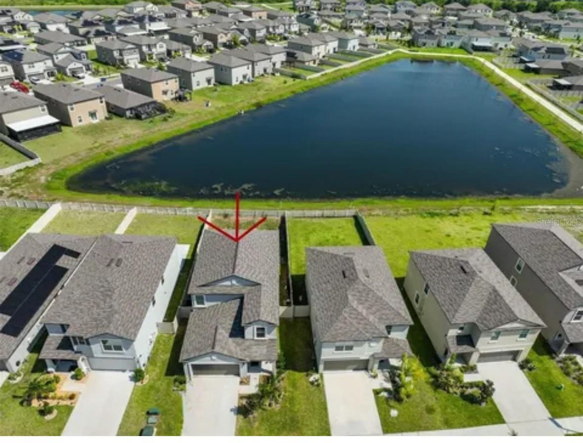MOVE-IN READY! Like-New LENNAR Home, built in 2022 on a Premium Pond-Front Lot. Backyard has been completely Privacy-Fenced with WhiteVinyl Fencing...This "Columbia" Model's Light & Bright, open Floorplan flows nicely; From the Entry & Foyer, the Guest Half-Bath, the Dining Room & Kitchen with Breakfast Bar, and the Living Room are all in WhiteCeramic Tile, leading you to the nice, private, Water-View out back...Kitchen has Solid Wood WhiteCabinets, Granite Counter Tops, and ALL Newer Stainless-Steel Appliances. The Walk-In Pantry has Plenty of Shelves for Storage, the Laundry Room is directly off the Kitchen and has Newer Washer & Dryer. SPECIAL FEATURES in this Home include;BOTH the STOVE & DRYER ADAPT to YOUR CHOICE of using EITHER GAS OR ELECTRIC ! HOME ALSO has a TANKLESS WATER HEATER, which means; NEVER-ENDING HOT WATER! the PRIMARY BEDROOM&BATH are LOCATED on the MAIN FLOOR for PRIVACY, and at the back of home for the WATER-VIEW.This Master Suite has Premium Wood-Laminate Flooring all thru the Bedroom, Walk-In Closet & Bathroom.The entire remainder of home, including; the Staircase, the large Loft area for Game-Room or Movie-Night, the Full Bath and all 4 Bedrooms upstairs. COMMUNITY FEATURES include; Clubhouse, Resort-Style Pools, Fitness Center, Playgrounds, Dog Park, Walking & Biking Trails, and Tennis & Basketball Courts! Just a short drive to Apollo Beach's State Park with Beach Access, and E.G Simmons Park in Ruskin for Fishing, Cabin Rentals, Camping, Showers, Beach Access, Boat Ramp and Grills & Gazebos for Cookouts in the Park ! Belmont is located just south of Tampa by Waterset & I-75 Exit in Apollo Beach. EASY ACCESS to Top Schools & Hospitals, Brandon Mall, Tampa International Airport, & MacDill Air-Force Base...NIGHTLIFE, EVENTS, SPORTS & ENTERTAINMENT for ALL AGES ! SHOPPING & DINING, Visit Historic HYDE PARK, the Columbia Restaurant & Cigar Shops in YBOR CITY, TAMPA RIVERWALK, BUSCH GARDENS, ADVENTURE ISLAND, CHANNELSIDE, RAYMOND JAMES STADIUM, AMALIE ARENA, the FLORIDA AQUARIUM, MANY FISHING CHARTER BOATS in the area & Don't MISS OUT on DISNEYWORLD & EPCOT CENTER a quick drive across the state ! With it's LOW HOA dues, this is a great are to relocate to !