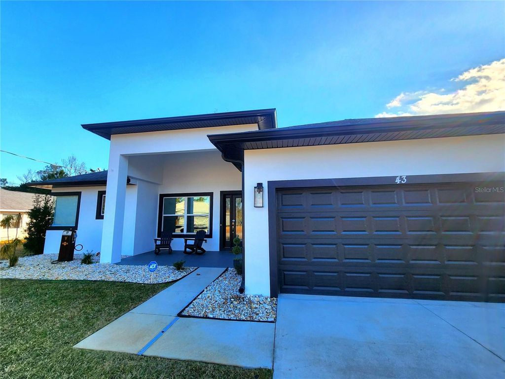 Photo of 43 Fenimore Lane, Palm Coast, FL 32137 (MLS # FC315919)