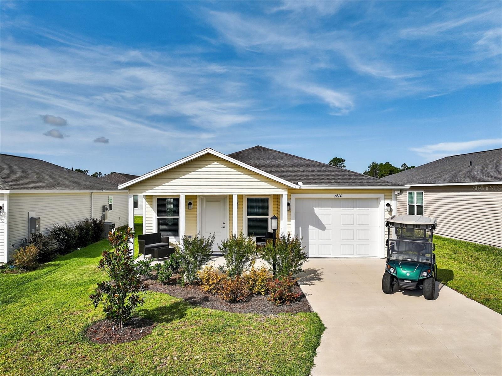 Turnkey, move in ready, including golf cart!! Welcome home!! Whether you're looking for a great Florida get-a-way home or you're an investor looking for a property that will draw lots of interest in The Villages, you've got to see this home! Step into the comfort and contemporary charm of this beautifully finished two-bedroom, two-bath residence where thoughtful details and quality craftsmanship come together seamlessly. From the moment you arrive, you’re welcomed by a covered front porch that invites you to pause and savor a quiet morning coffee or relax in the shade on warm afternoons.
Inside, an open floor plan unfolds beneath soaring high ceilings, creating a bright, airy ambiance that feels both expansive and inviting. The spacious living area is anchored by luxury vinyl plank flooring that complements plush carpeting in the bedrooms, blending style with comfort. Natural light pours through energy-efficient windows adorned with elegant blinds, while ceiling fans keep the air fresh and cool.
The kitchen is designed for effortless everyday living, showcasing solid wood cabinets that provide abundant storage, sleek stainless appliances, including a gas range for all your culinary adventures. Take advantage of the oversized island to entertain friends, or do meal prep! Whether you’re preparing a casual meal or entertaining guests, the heart of this home makes every occasion feel special.
The primary bedroom, offers a tranquil retreat complete with a spacious walk-in closet and an ensuite bathroom designed with a walk in shower. A second bedroom and bathroom provide comfortable accommodations for family or guests, all styled with clean lines and modern finishes.
This home is turnkey and ready for you to move right in, including smart home features that make it as functional as it is beautiful. Just show up, drop your bags and hop on the golf cart and take a 10 minute ride down to Sawgrass where you can grab dinner or drinks and listen to live entertainment nightly! Love golf? You're just a 5 minute golf cart ride to the Mickeylee pitch and putt, or 10 minutes away from the beautiful Southern Oaks Championship golf course! This location has it all! Head on over to the Franklin Recreation Center to meet up with friends for a game of pickleball or shuffleboard, or just relax and cool off in the beautiful resort like swimming pool. What are you waiting for? Come home to 1214 Eunice Street, we're waiting for you!
Outside, mature landscaping and an irrigation system ensure your yard remains lush and green without the hassle. The attached 1.5-car garage, complete with automatic door opener, offers plenty of space for vehicles and hobbies alike. Rain gutters and thoughtful exterior lighting further enhance the home’s curb appeal while making maintenance simple.
Whether you’re unwinding on your covered patio, appreciating the neat, low-maintenance lot, or enjoying the convenience of central heating and air conditioning, this property is designed to elevate every aspect of your day-to-day life. Come discover the perfect blend of style, comfort, and ease—all waiting for you to make it your own. You really can have it all - and at a price that can't be beat!