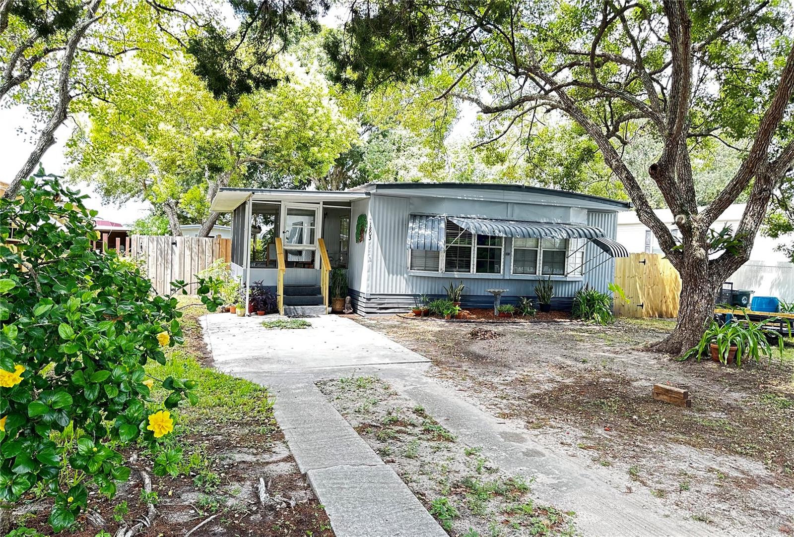 Welcome Home to a 3BR/2BA Beautifully updated Open concept floor plan home with large bay windows that bring in tons of natural light. Enter through our front porch patio with plenty of cover for relaxing during those hot or rainy Florida days. The front patio will take you to the front door that opens up to a large totally remodeled Great Room equipped with a breakfast bar, dining area and Great Room with plenty of room for your family. This home boasts 3 bedrooms and 2 Baths. Third bedroom in the back of the house can be accessed from the main home and from the back porch having tons of potential as a craft room, private office or man cave. But that's not all, imagine relaxing on your back patio overlooking your fenced yard enjoying your private fish pond located on a small corner of your back patio. Lastly enjoy working in your very own 15 x 11 work shop.