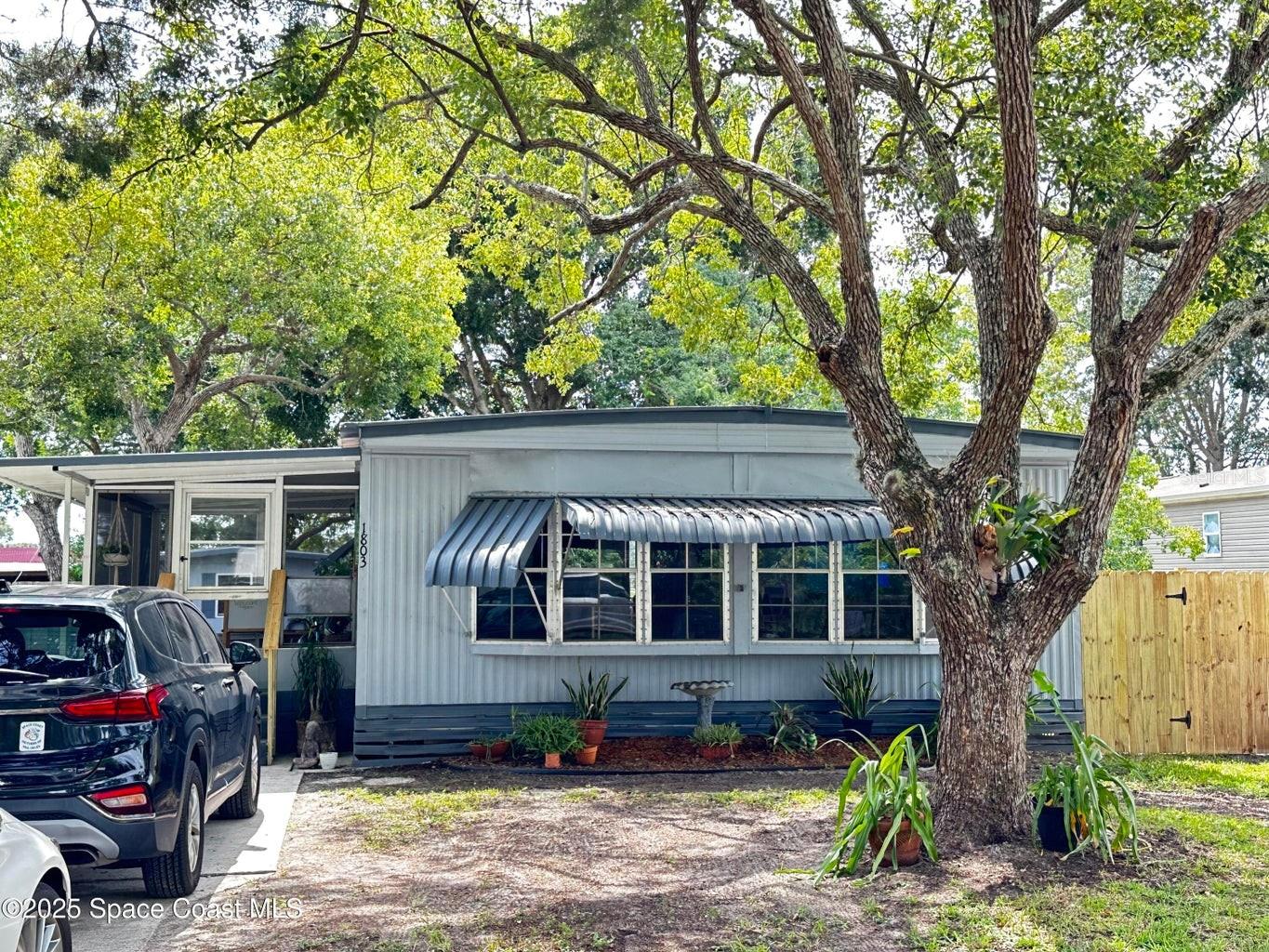 Welcome Home to a 3BR/2BA Beautifully updated Open concept floor plan home with large bay windows that bring in tons of natural light. Enter through our front porch patio with plenty of cover for relaxing during those hot or rainy Florida days. The front patio will take you to the front door that opens up to a large totally remodeled Great Room equipped with a breakfast bar, dining area and Great Room with plenty of room for your family. This home boasts 3 bedrooms and 2 Baths. Third bedroom in the back of the house can be accessed from the main home and from the back porch having tons of potential as a craft room, private office or man cave. But that's not all, imagine relaxing on your back patio overlooking your fenced yard enjoying your private fish pond located on a small corner of your back patio. Lastly enjoy working in your very own 15 x 11 work shop.