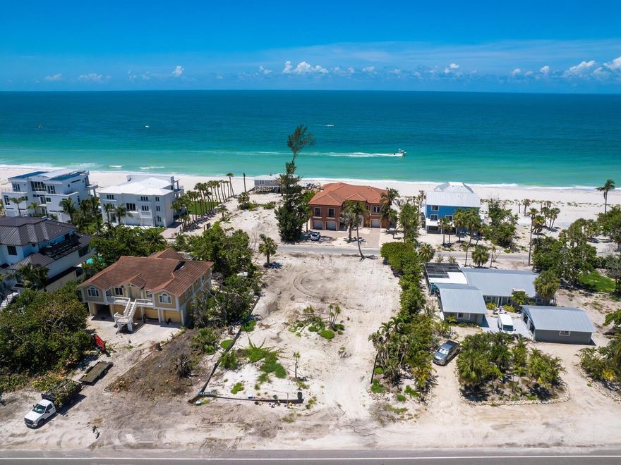 No busy street to cross!!  Situated on the west side of Gulf of Mexico Dr, build your dream home on this large lot (16,000 sq ft) just steps from the sugar sand beach on beautiful Longboat Key on the Gulf.  This lot has the added bonus of backing up to Gulfside Road with a very short walk to beach access at the end of the street.  Longboat Key is a barrier island situated off the Gulf Coast of Florida and has so much to offer — beach, boating, tennis, pickleball, cycling and more.  Fly straight into Sarasota airport and enjoy quick access to Longboat Key, Anna Maria Island, St. Armands Circle, downtown Sarasota and the University Town Center.