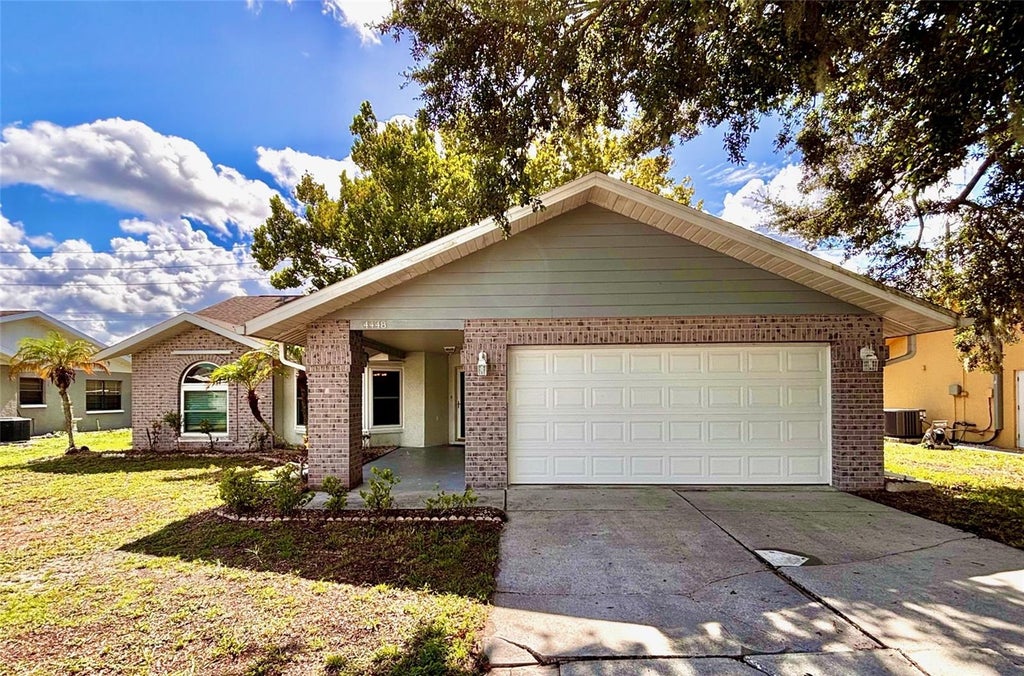 Photo of 4448 County Breeze Drive, New Port Richey, FL 34653 (MLS # TB8531071)