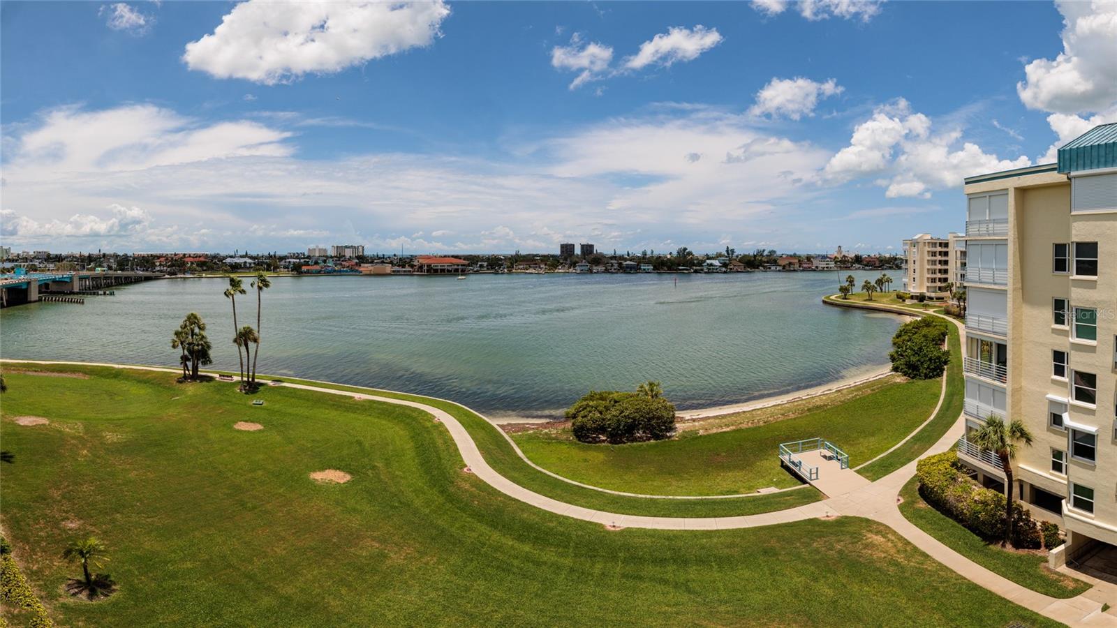 Come see this beautifully updated end unit condo in the highly desired HarbourSide waterfront community! This spacious 2-bedroom, 2-bath home with a den has been completely remodeled, including a reimagined kitchen that truly sets this condo apart. Enjoy elegant crown molding, wood floors, a wet bar, water softener, storm shutters, and an expanded den perfect for extra living or office space. This end unit has two spacious balconies, you have the front one for the sunrises and enjoy the sunsets from the back one. This unit also comes with an assigned under-building parking spot #146. HarbourSide offers resort-style living just minutes from St. Pete Beach. This gated community features 6 pools, a marina with 87 deeded slips (slips available for purchase or lease) not one with this unit, tennis/pickleball courts, shuffleboard, his & hers fitness centers with saunas, clubhouse with heated pool/spa, library, craft room, billiards room, outdoor grilling areas, car wash station, and a lively social calendar. Enjoy peaceful walks along the 1.5-mile waterfront path that surrounds the island. You would be hard presses to find a community with more amenities for your enjoyment. Live the Florida dream in this exceptional home!