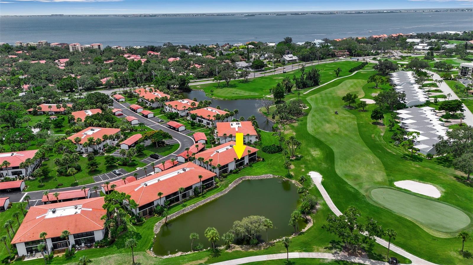 Rarely available ground floor unit with simply one of the best lots in Valencia! Welcome to this beautifully updated, ground floor, 2bd/2ba condo w/courtyard, located in the highly sought after IMG Golf Course community of Valencia Gardens. Be ready to fall in love with the stunning IMG Golf Course and pond views! Featuring 2 spacious bedrooms, updated bathrooms, open and remodeled kitchen and hurricane impact windows and doors. Enjoy sweeping golf course and pond views from your enclosed Florida room that offers additional living area and impact sliding doors. Unwind or grill in your front courtyard which leads to a front screened patio which also offers a laundry closet with washer and dryer. Lushly landscaped community pool and hot tub offers a relaxing resort feel and is just across the street from this condo. Prime location offers close proximity to either downtown Sarasota or Bradenton and just a short drive to Anna Maria Island and the gorgeous gulf beaches found there. IMG Golf and Country Club just down the road offers public golf and dining and close proximity to IMG Academy, shopping, restaurants and SRQ Airport. Carport and guest parking available. Sorry, no trucks or motorcyles allowed and must own 2 years prior to renting. Valencia III is pet friendly and does allow large dogs (ask about pet restrictions). This is a rare opportunity to own a move-in ready ground floor unit on the IMG Golf Course. List of partial furnishings with the sale is available. Whether you are looking for a full-time residence or seasonal escape this property checks all the boxes!