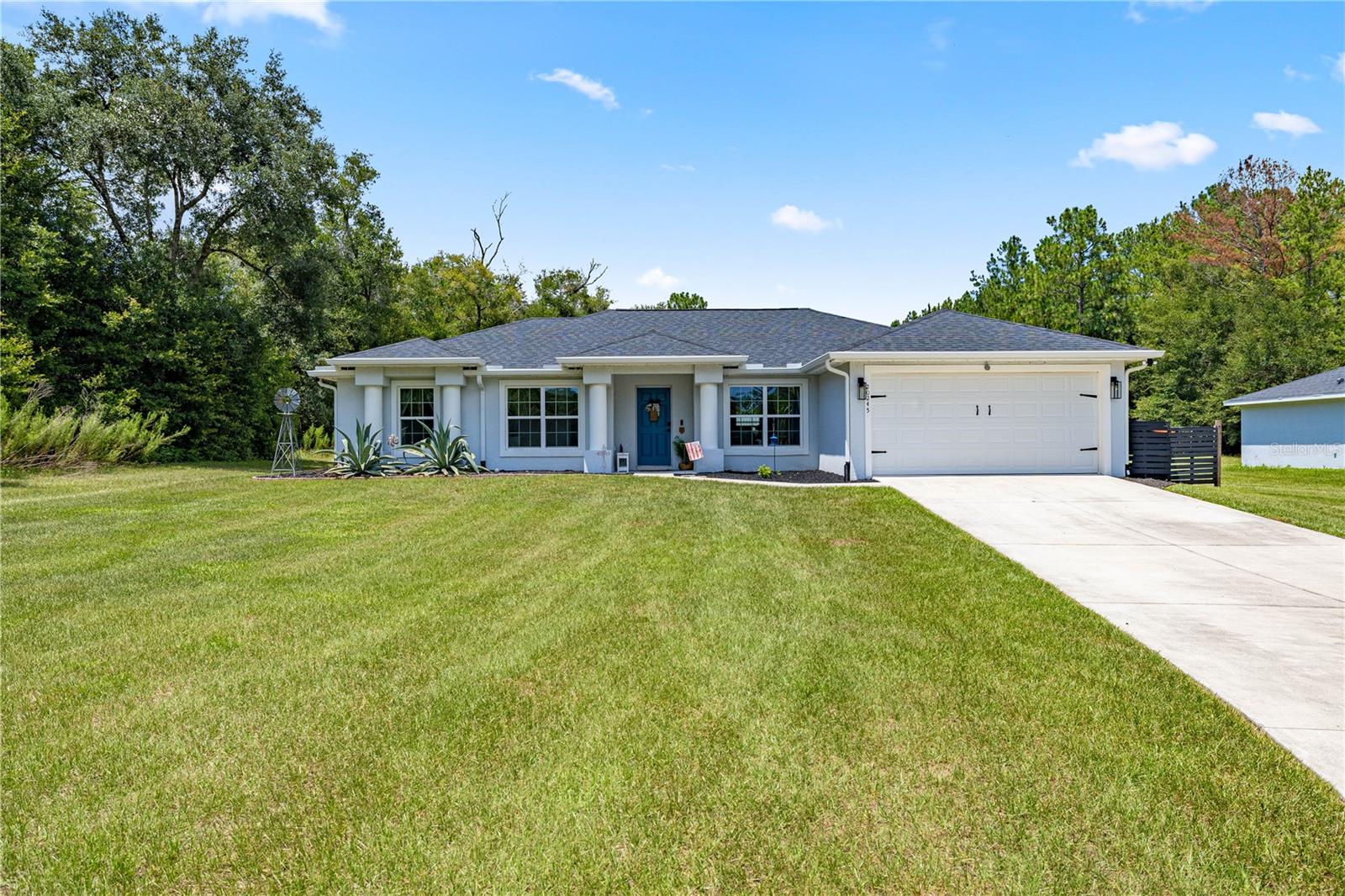 Beautiful 3-bedroom, 2-bath home with a bonus office/flex room. Located on 1 acre with NO HOA! Built in 2020, this move-in-ready home features hard stone countertops, wood shelving upgrades, and includes washer and dryer. The open floor plan flows to a paver back patio with decorative lighting—perfect for relaxing, grilling, or a hot tub. The backyard includes a chicken area, lean-to for lawn equipment, and a large shed with electric. Scenic views out back and only one neighbor to the right. Long driveway offers ample parking for vehicles and recreational toys. Enjoy the tranquility of country living while being close to Rainbow Springs State Park, the World Equestrian Center, and all that Ocala provides. Schedule your showing today!