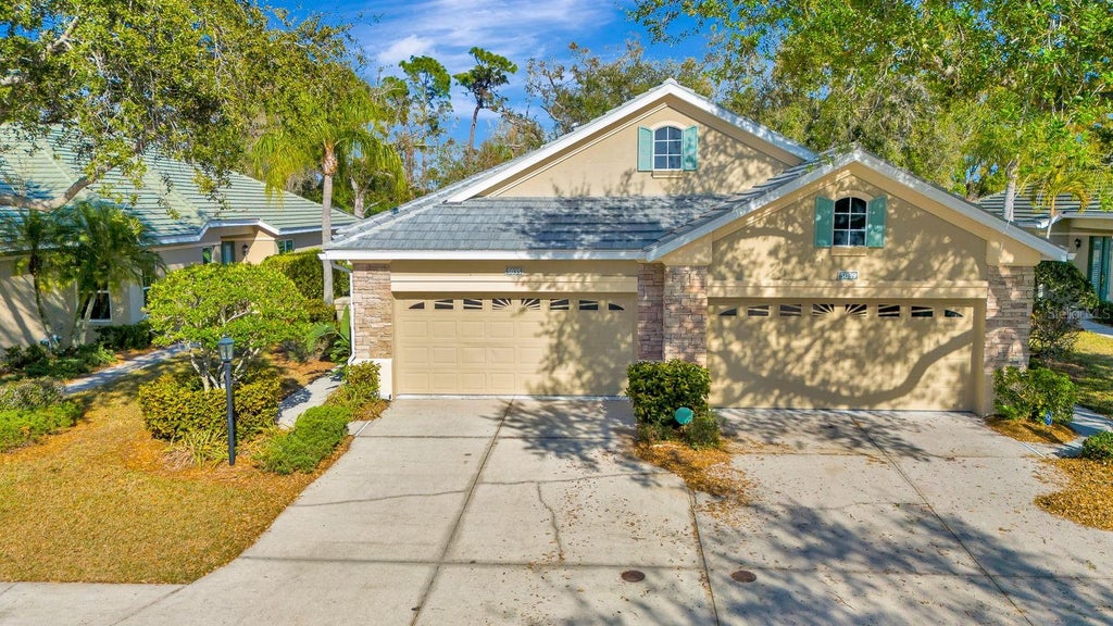 Photo of 5035 Lakescene Place, Sarasota, FL 34243 (MLS # A4711010)