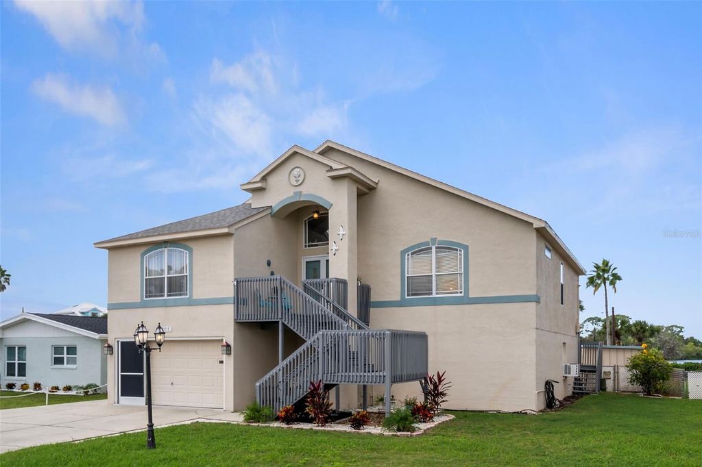 Photo of 6719 Manor Beach Road, New Port Richey, FL 34652 (MLS # TB8436343)