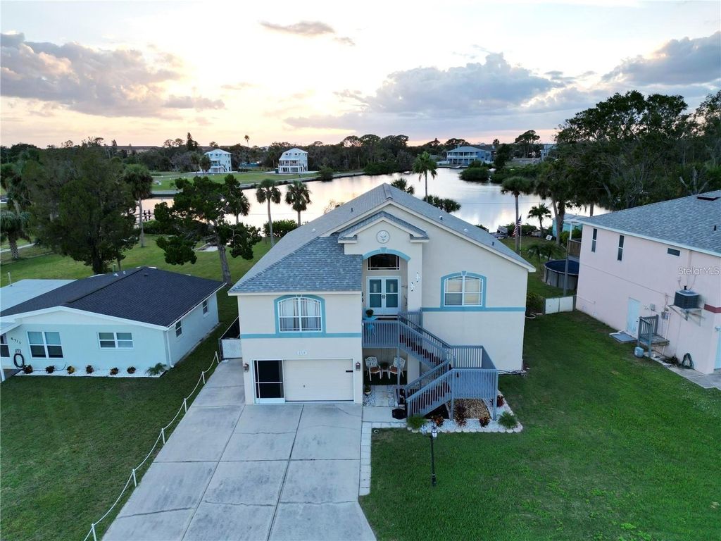 Photo of 6719 Manor Beach Road, New Port Richey, FL 34652 (MLS # TB8436343)