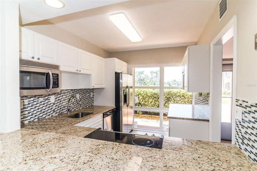 Beautiful quiet, safe, tucked away riverfront community. This tastefully remolded condo is ready for it's new owner!!! Large open floor plan boasting large floor tiles and NEW windows, sliding doors, kitchen cabinets, beautiful granite counters top and stainless appliances. This unit is located on the first floor with direct river views. The complex is equipped with first come first serve boat slips, kayak and canoe storage, bbq grills and picnic tables, well maintained and recently updated clubhouse, pool area and tennis courts! This place has it all!! Come check it out for yourself!! ;Water: City