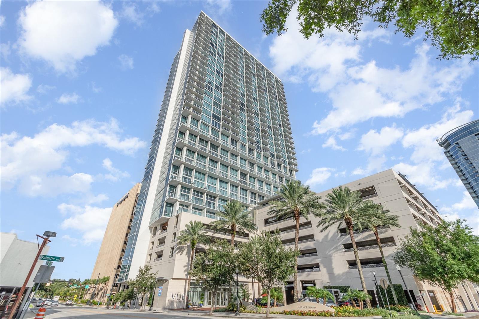 Welcome to The VUE at Lake Eola – where vibrant city living meets upscale, modern luxury. This FULLY FURNISHED, chic lakeside loft offers one of the most desirable floor plans in the building, featuring breathtaking views of Lake Eola through soaring 27-foot floor-to-ceiling windows with electric blinds. Fully furnished and thoughtfully designed, this 1-bedroom, 1.5-bath unit blends contemporary elegance with comfort and functionality. Available for lease with flexible terms, including 7-month rentals, this residence is ideal for those seeking a stylish urban lifestyle in the heart of downtown Orlando.
Inside, you’ll find beautiful new hardwood flooring and an open-concept living area perfect for entertaining. The sleek, modern kitchen features stainless steel appliances, granite countertops, a gas range, and ample cabinet space. A convenient half bath is located on the main level, while the upstairs owner’s suite includes a large walk-in closet, space for a home office, and a full-size washer and dryer for added convenience.
Step out onto your private balcony and enjoy views of Lake Eola. This rental also includes one premium assigned parking space located on the same floor as the unit for erasability, along with valet parking for guests. Gas, Water, and Trash are INCLUDED in the rent.
Residents of The VUE enjoy access to top-tier amenities including a resort-style pool with cabanas, state-of-the-art fitness center, cyber cafe with panoramic views, two outdoor grills, movie theater, tennis and basketball courts, dog park, wine cellar, and 24-hour concierge and security. Just steps away from Orlando’s best dining, shopping, and entertainment, this trendy, high-rise loft offers luxury living at its finest.